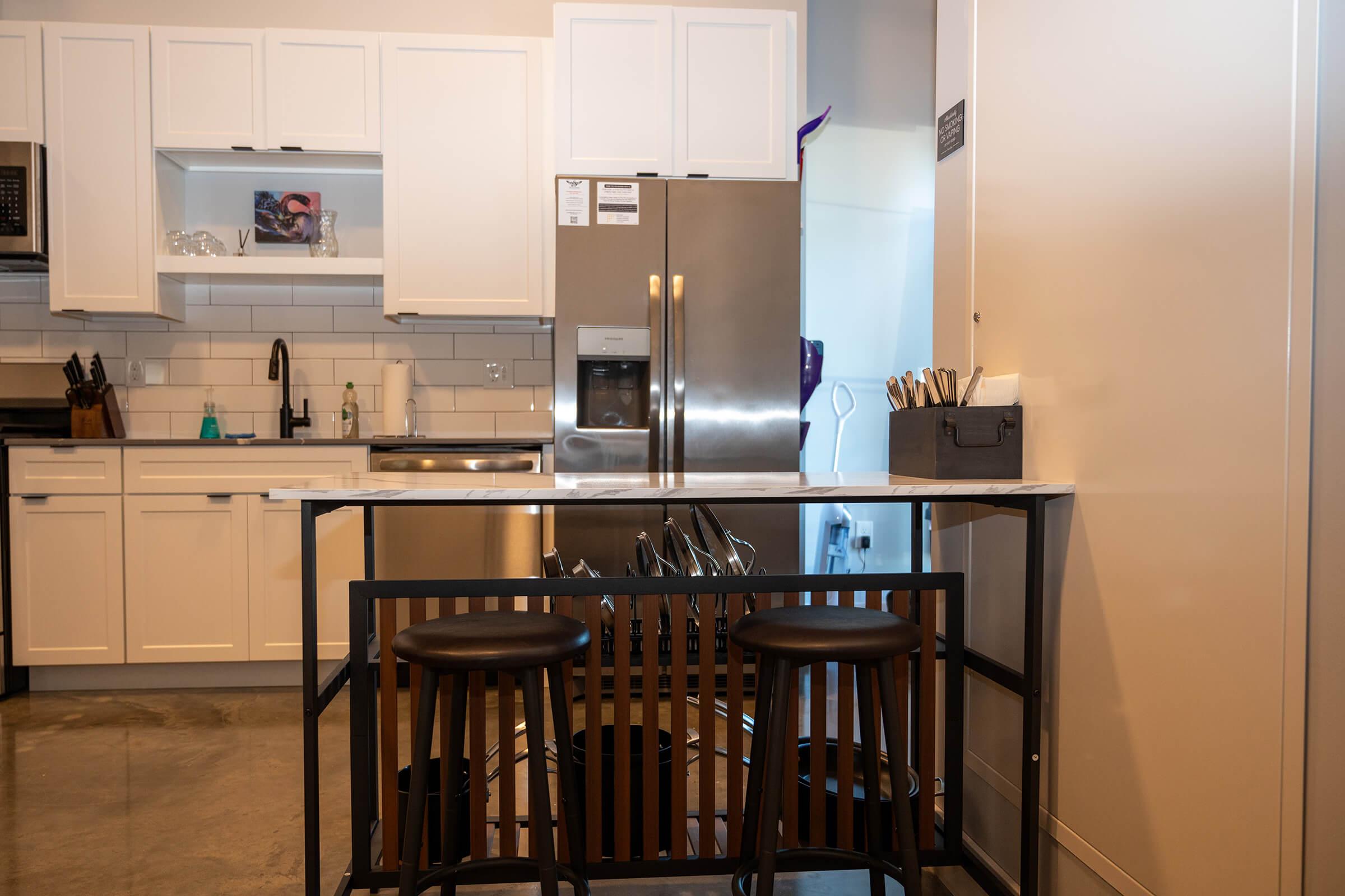 a kitchen with a dining table