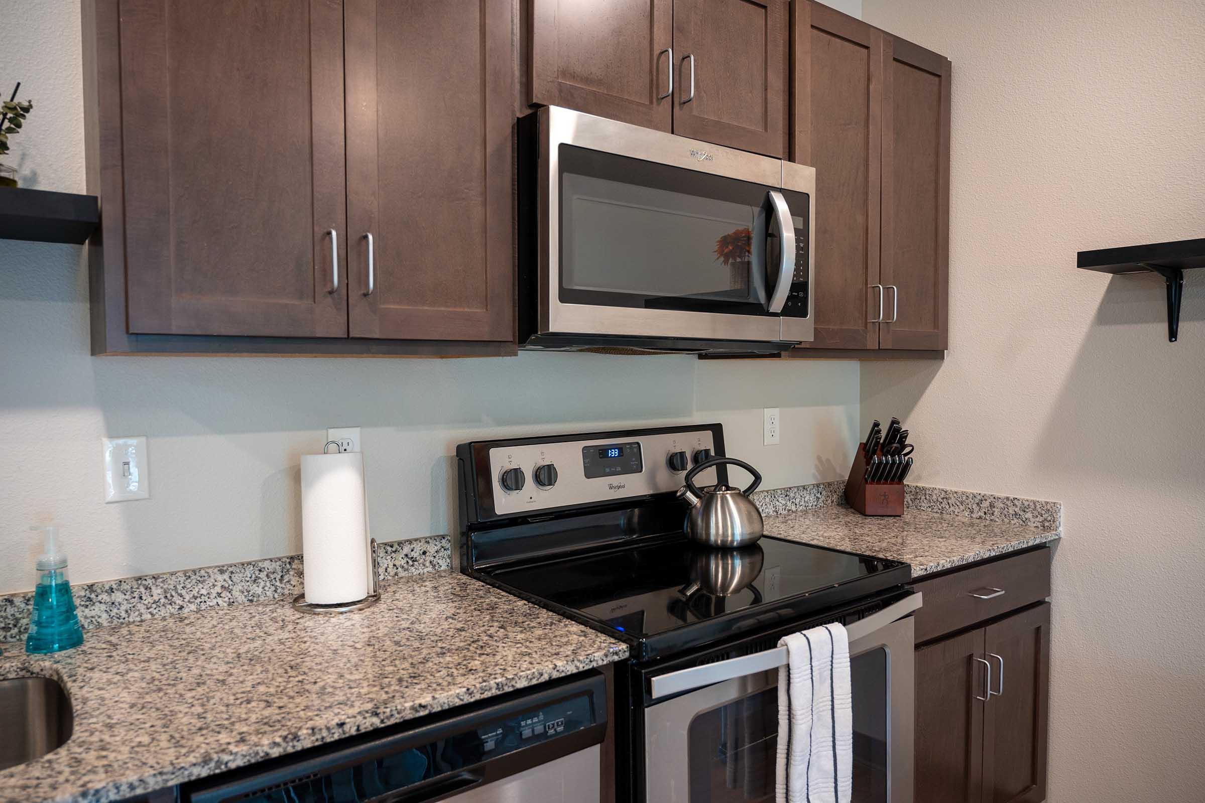 a kitchen with a sink and a microwave