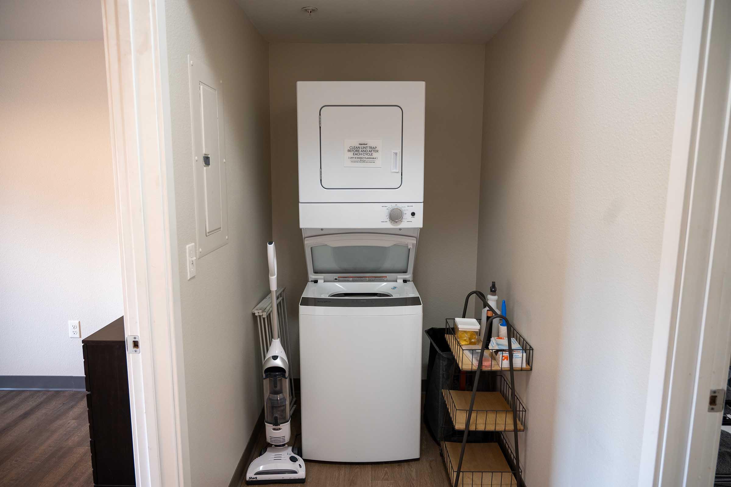 a microwave oven sitting on top of a refrigerator