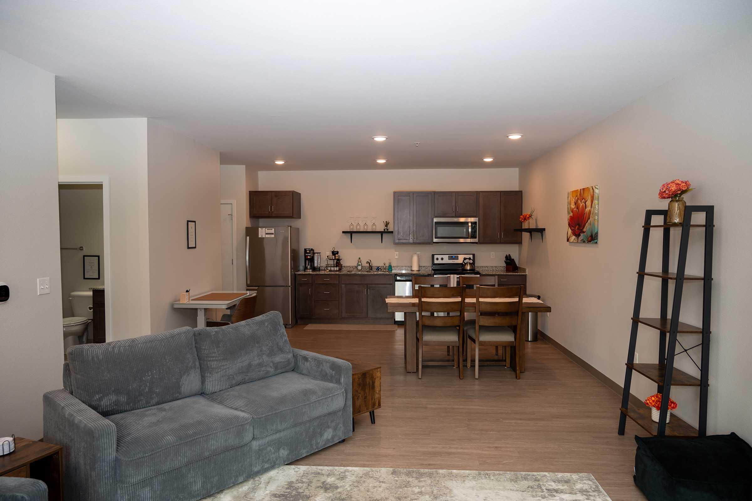 a living room filled with furniture and a table