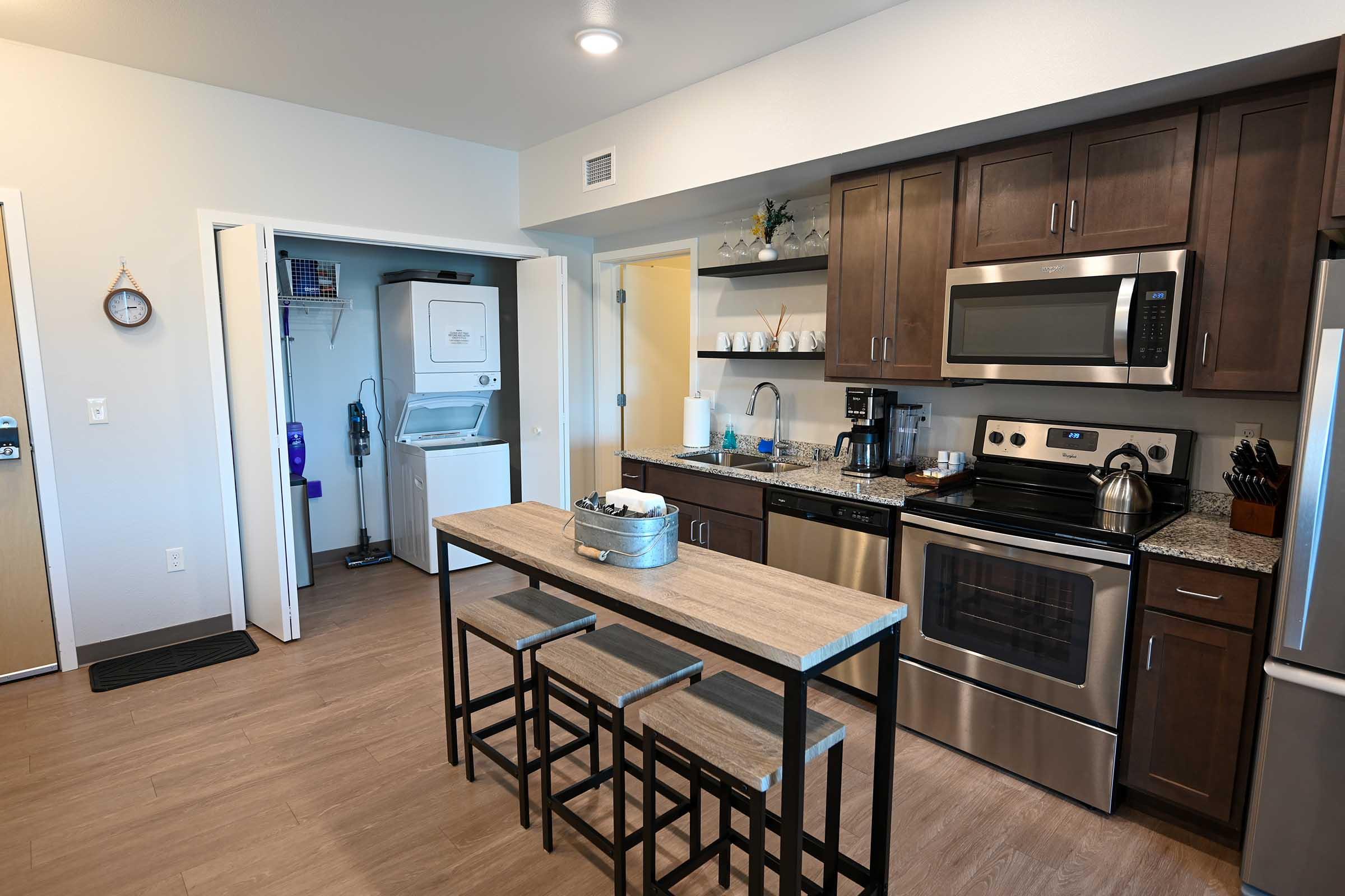 a large kitchen with stainless steel appliances