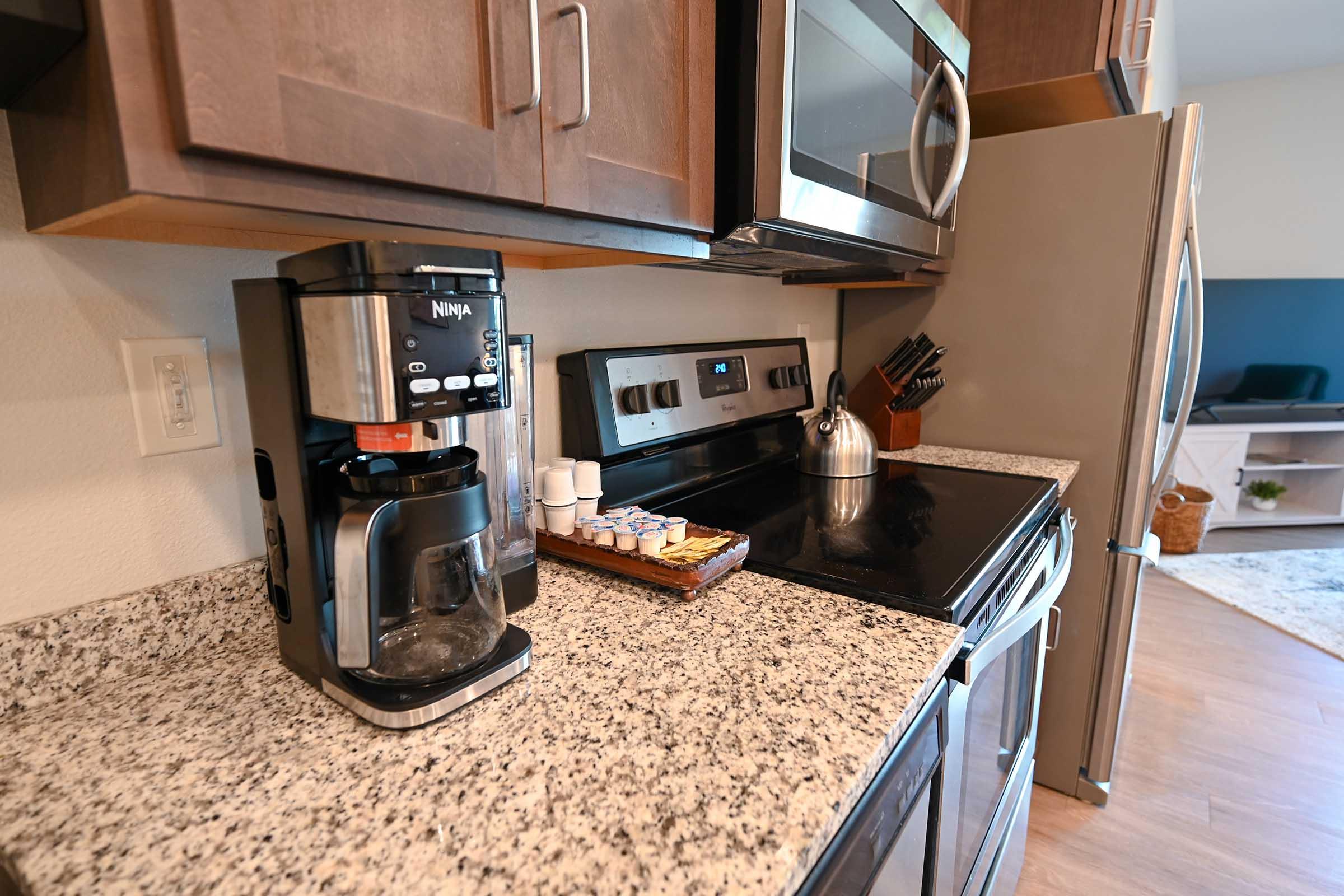 a stove top oven sitting inside of a kitchen