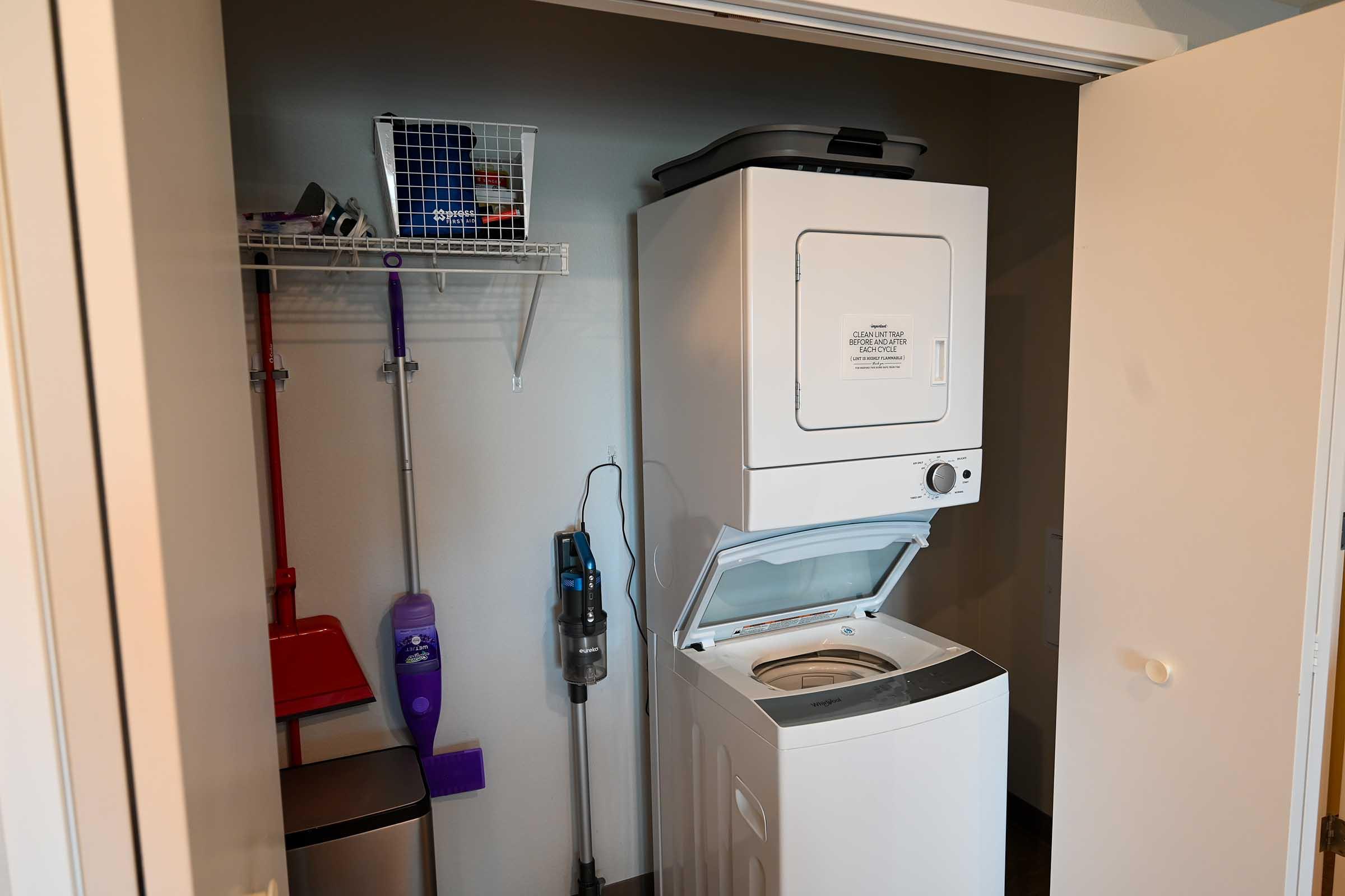 a microwave oven sitting on top of a refrigerator