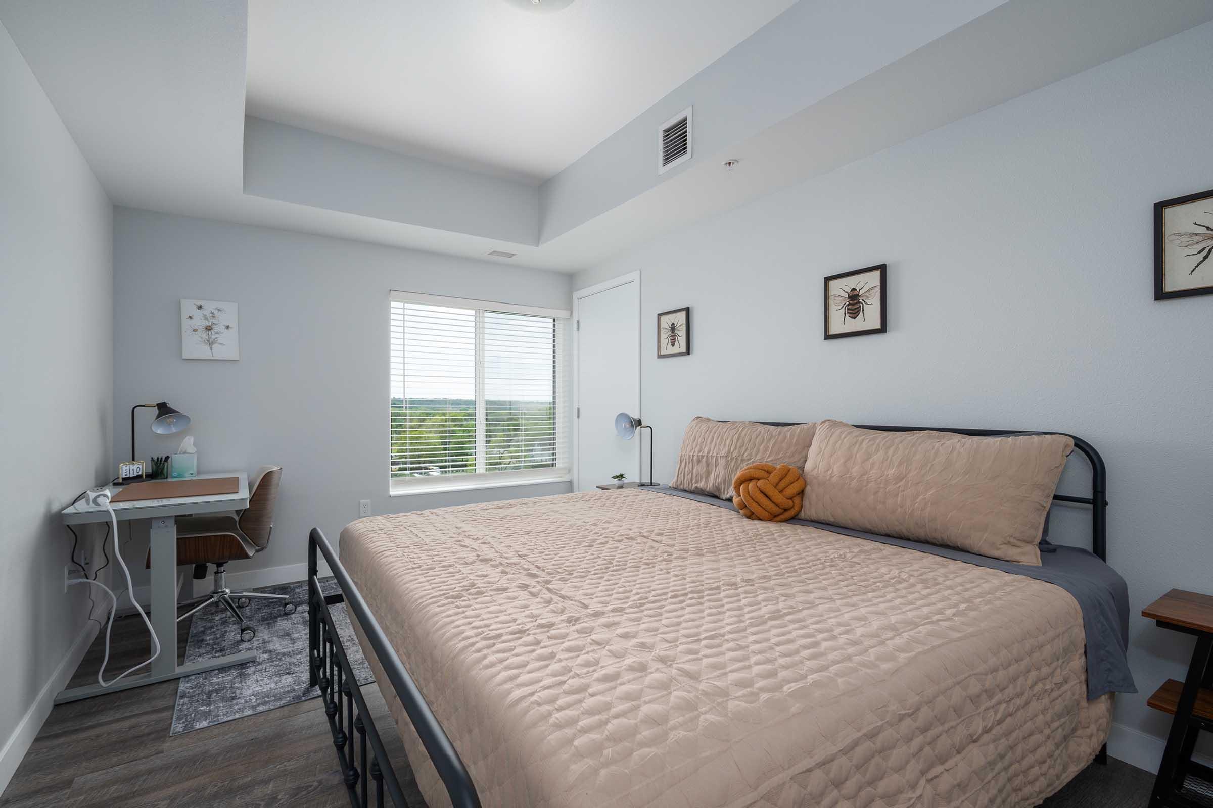 a bedroom with a large bed in a hotel room