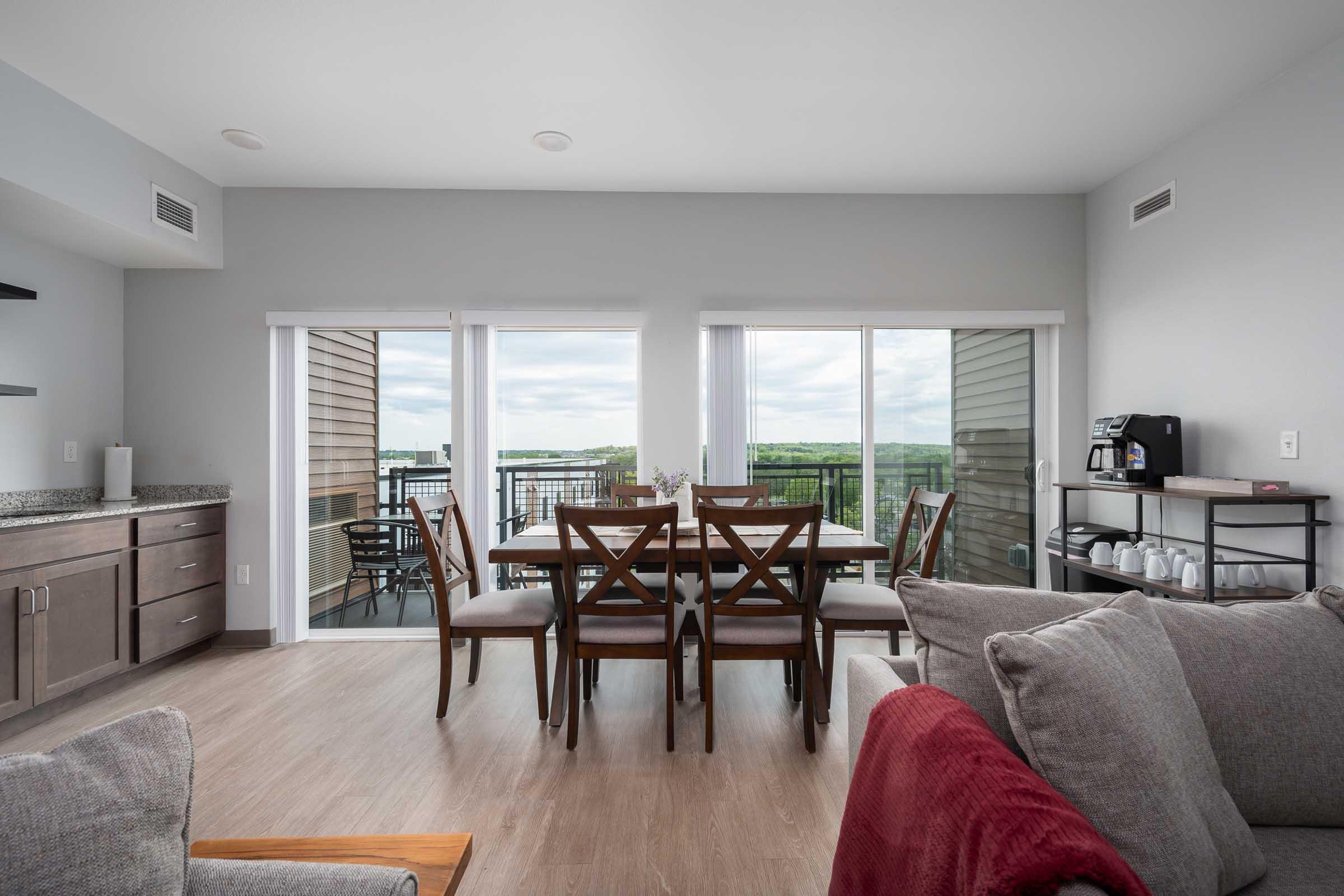 a living room filled with furniture and a large window