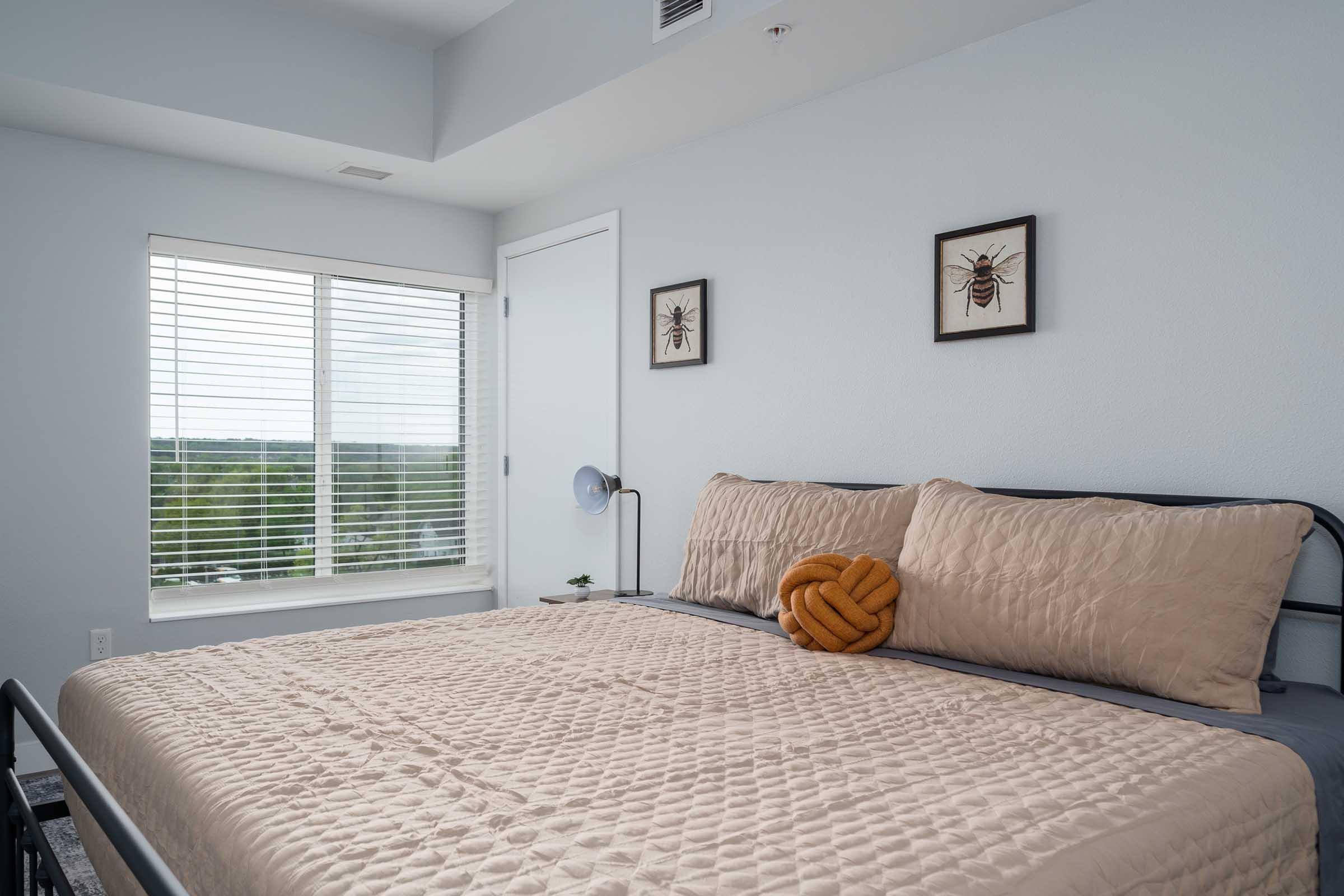 a bedroom with a large bed in a hotel room