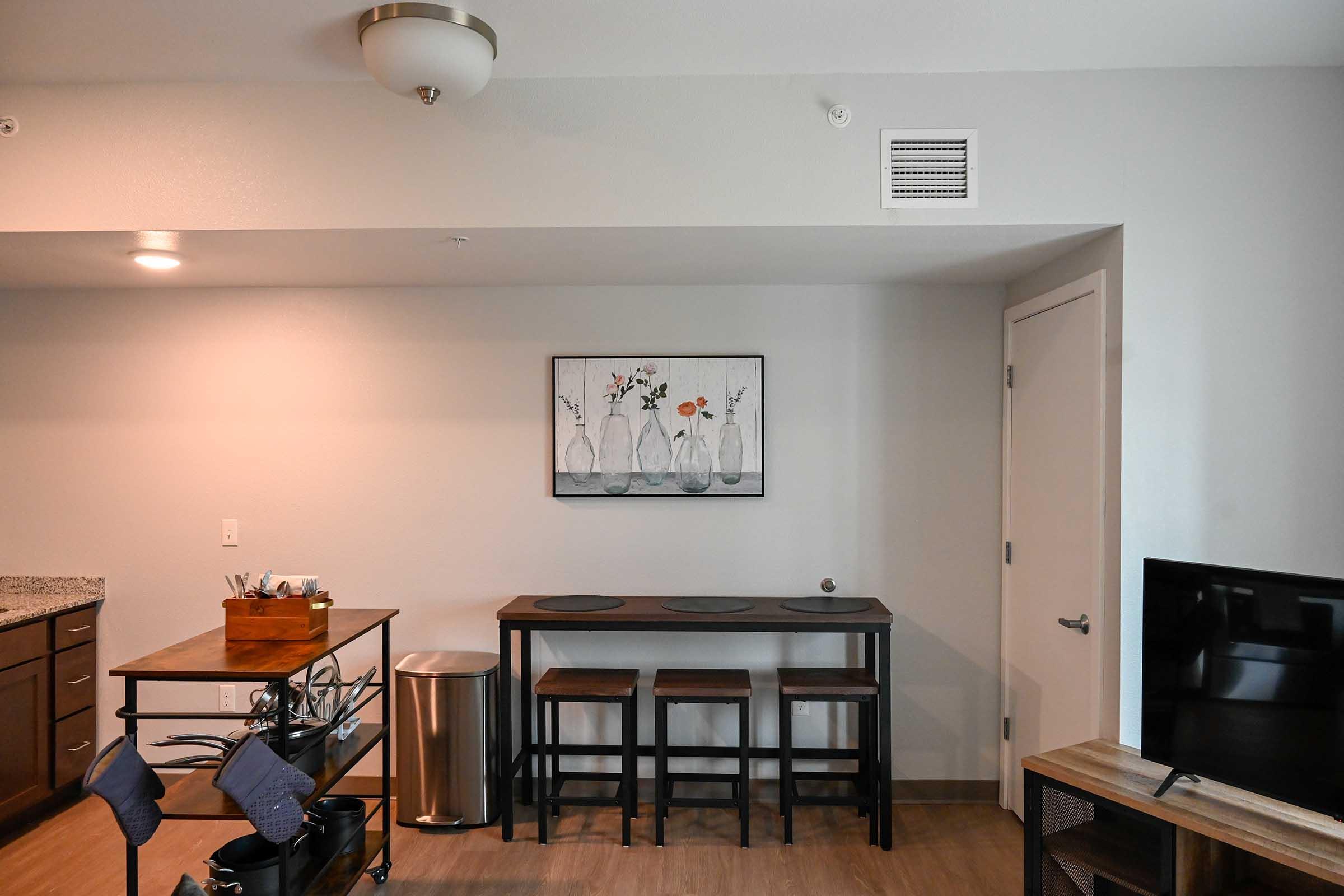 a living room filled with furniture and a flat screen tv