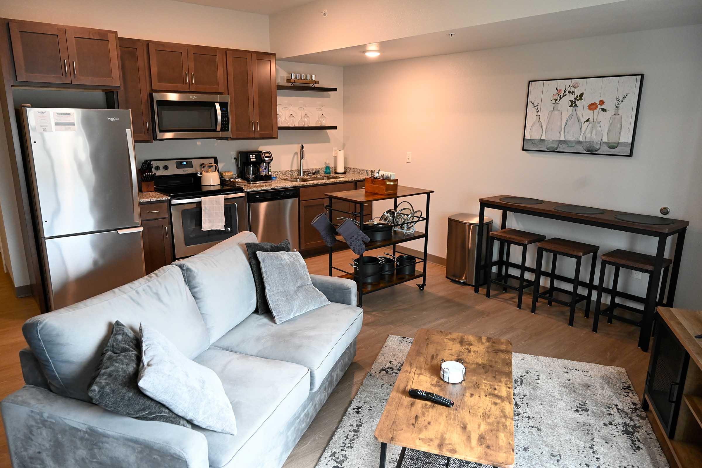 a living room filled with furniture and a table