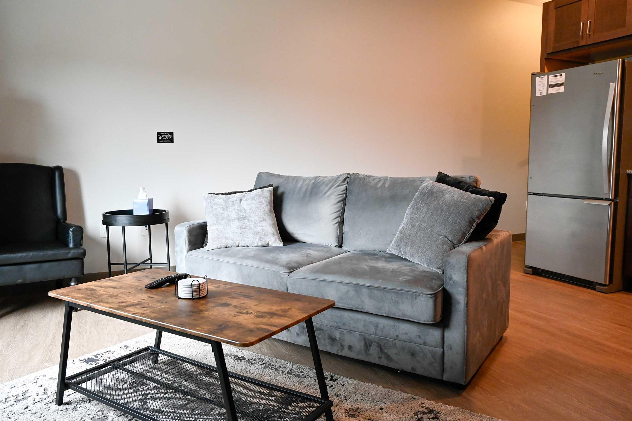 a brown leather couch in a living room