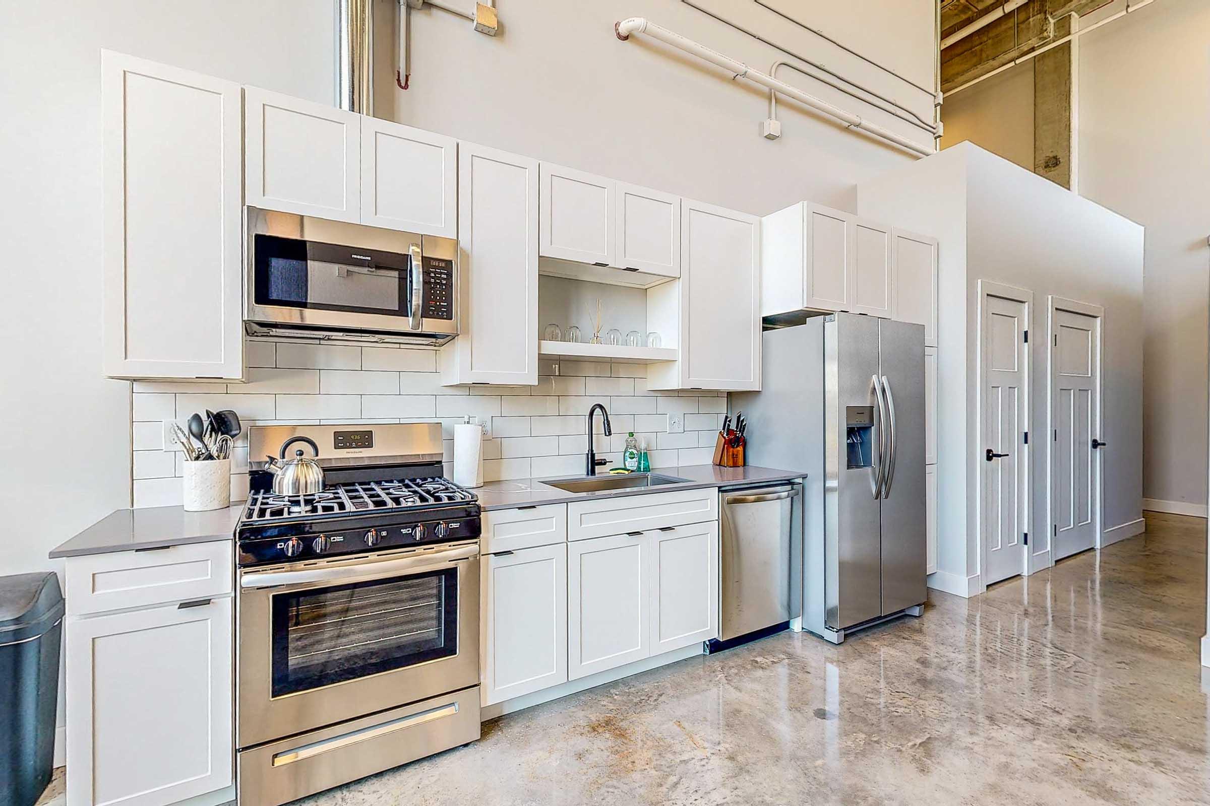 a kitchen with a sink and a microwave