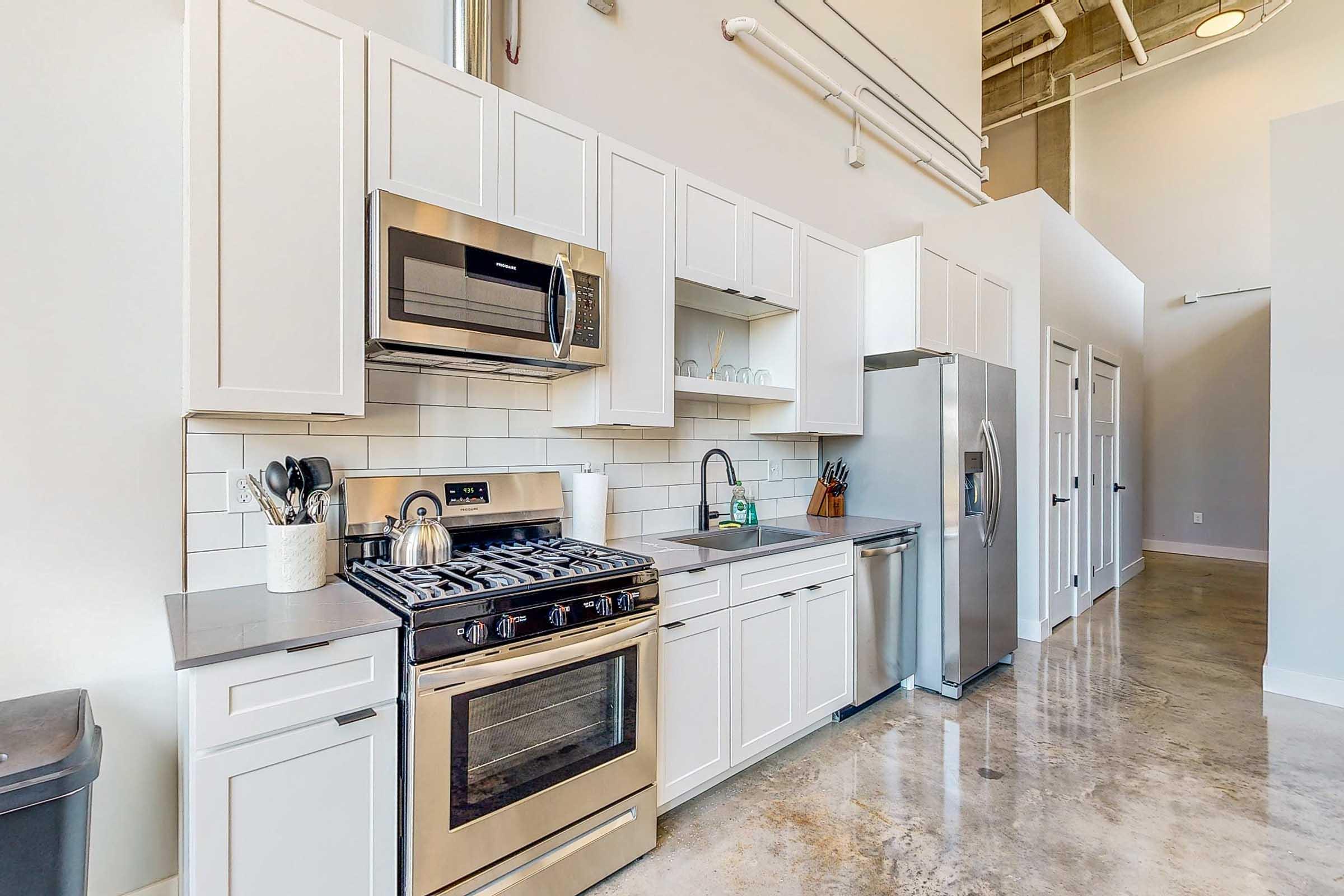 a kitchen with a stove top oven