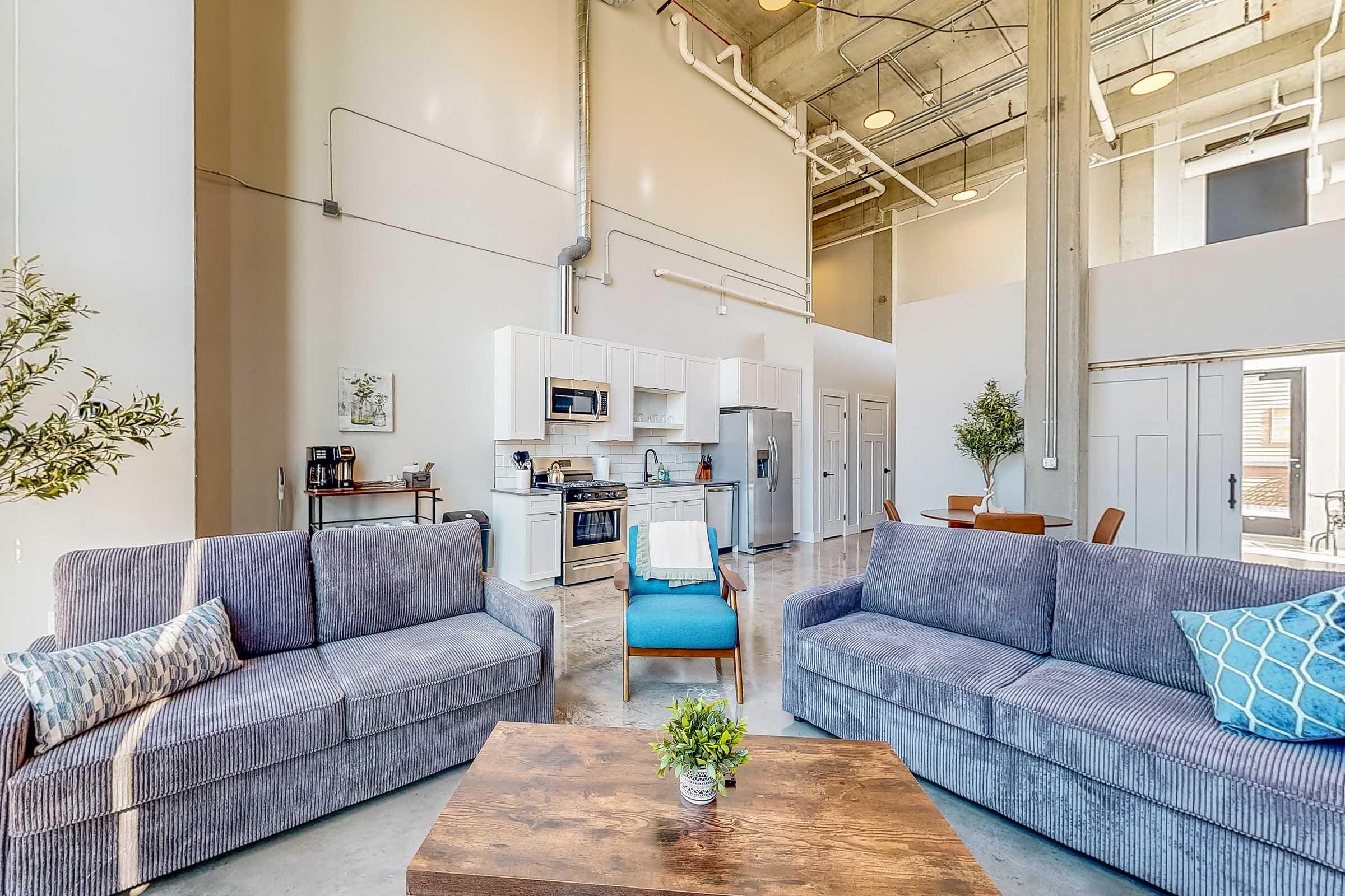 a living room filled with furniture and a rug