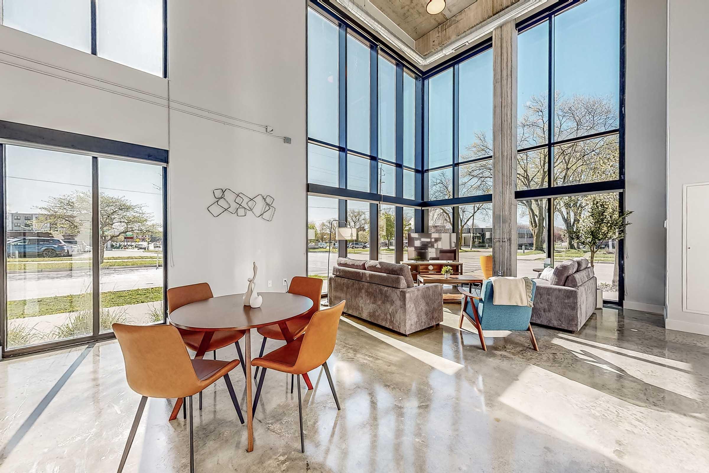 a room filled with furniture and a large window