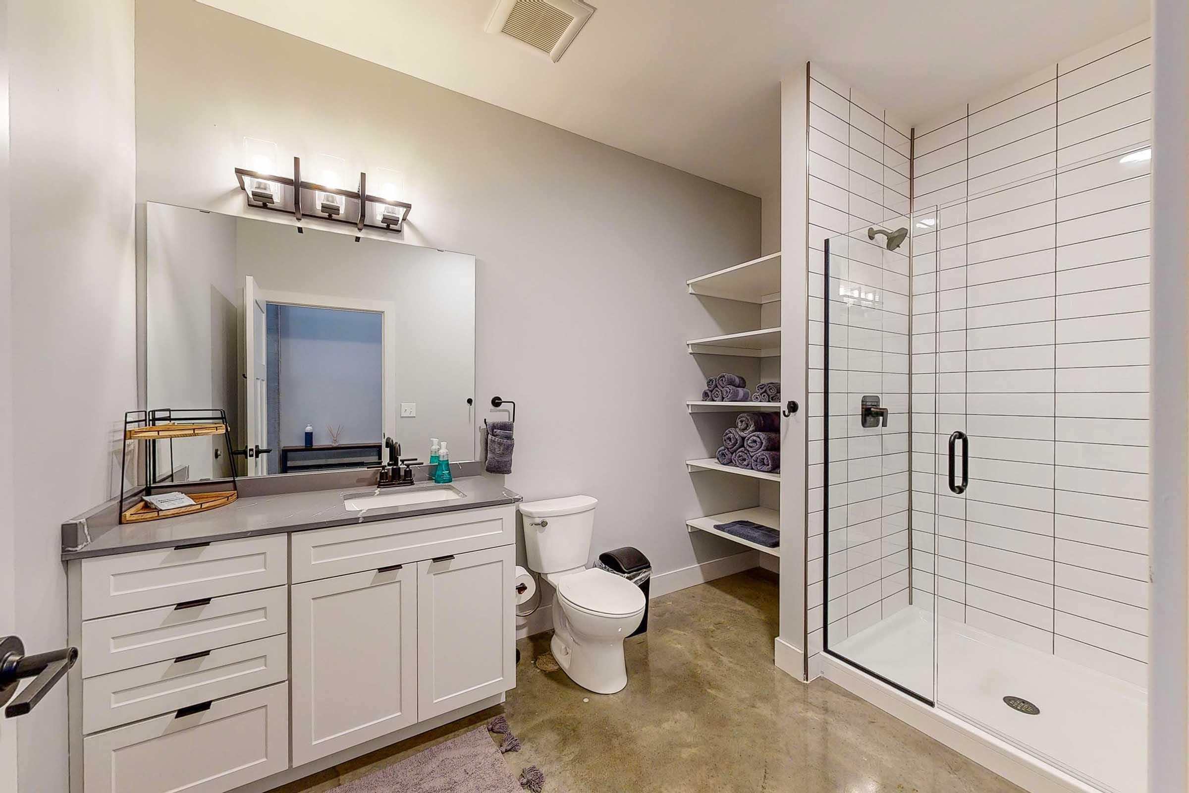 a kitchen with a sink and a mirror