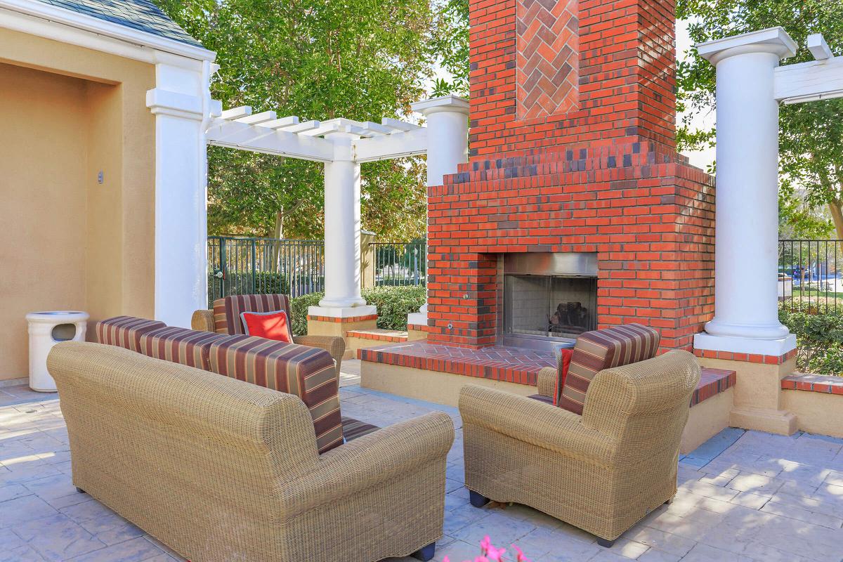Outdoor fireplace with couches