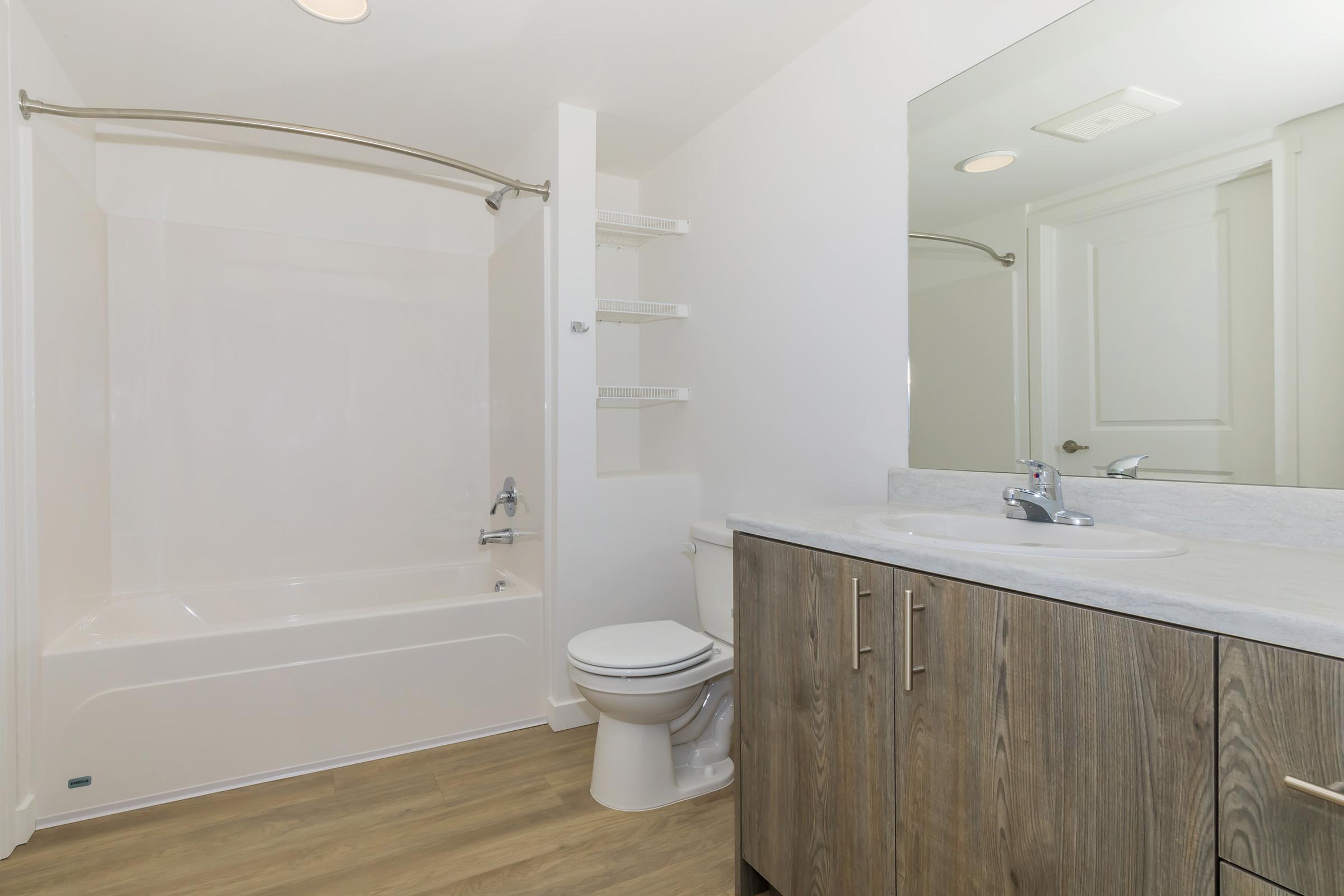 a room with a sink and a shower