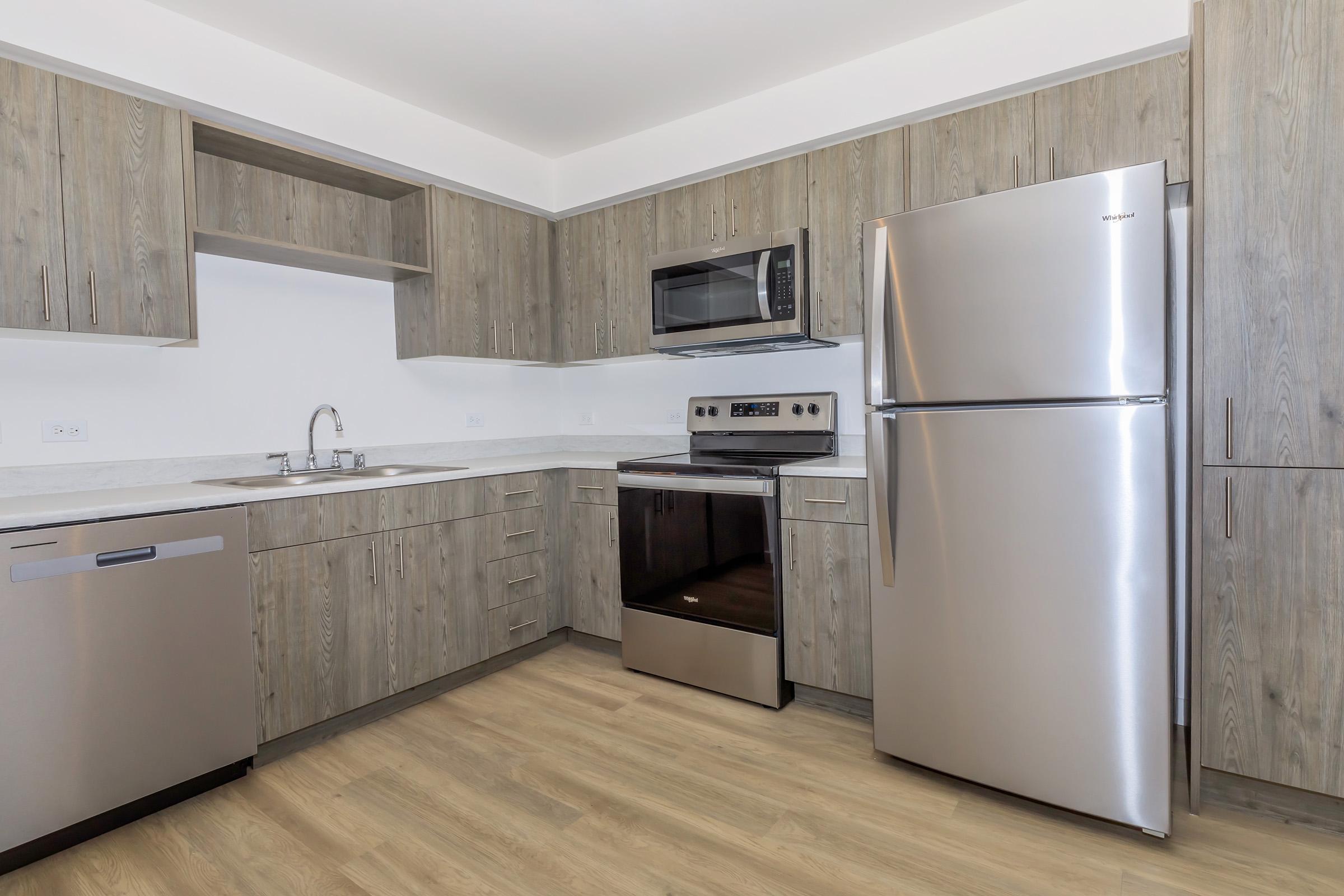 a stainless steel refrigerator in a kitchen