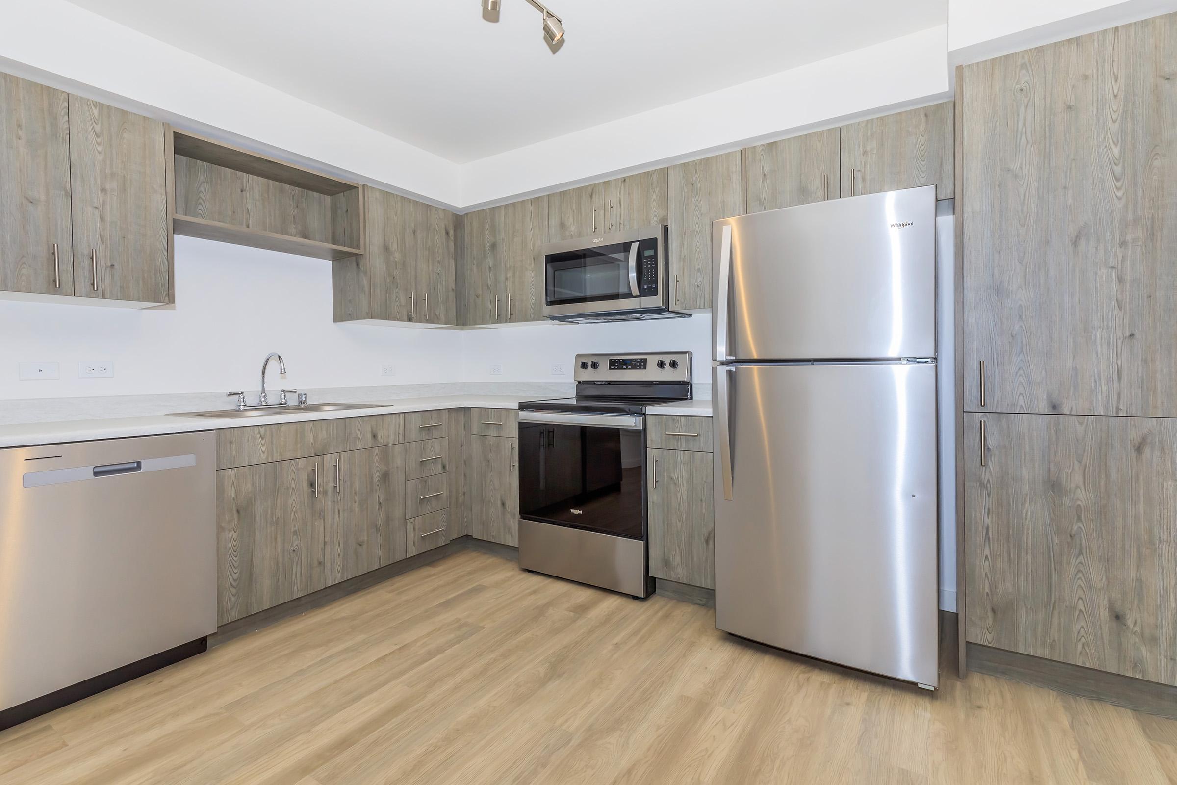 a stainless steel refrigerator in a kitchen