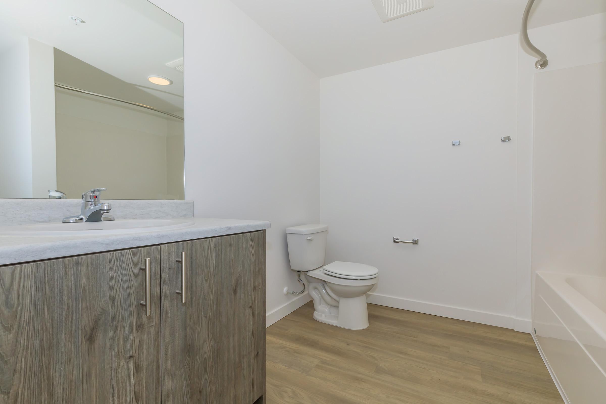 a large tub next to a sink