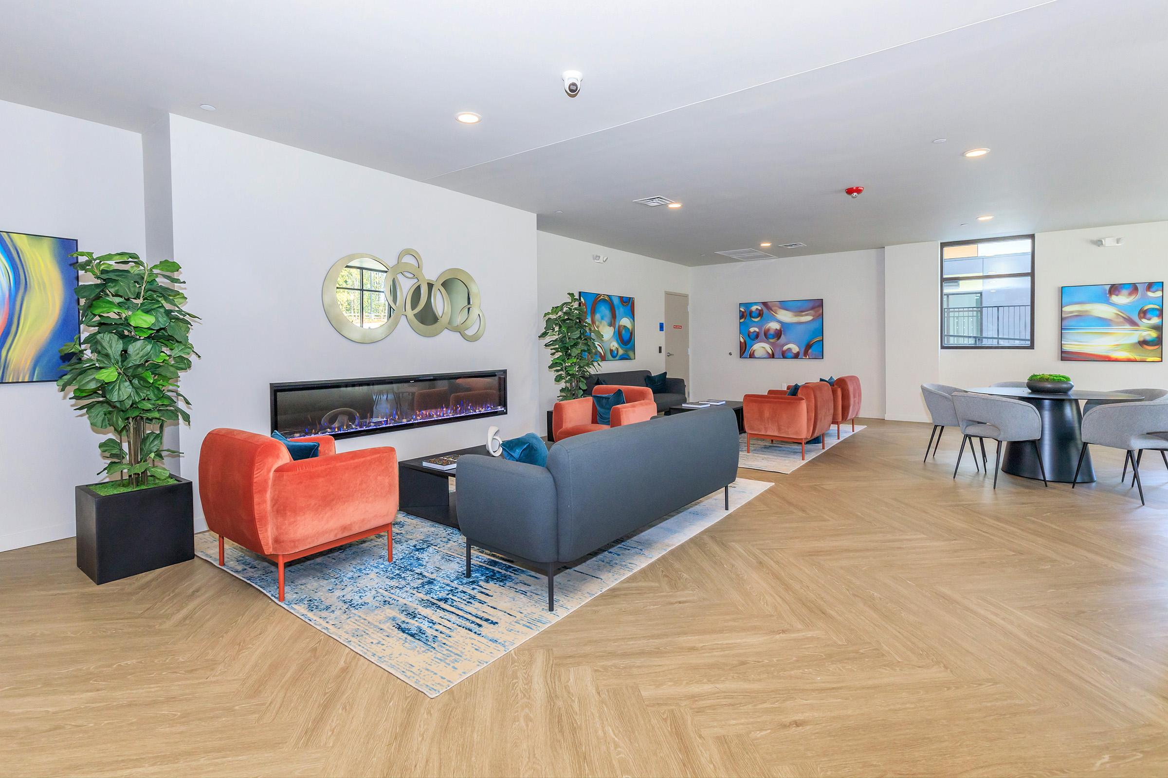 a living room filled with furniture and a flat screen tv