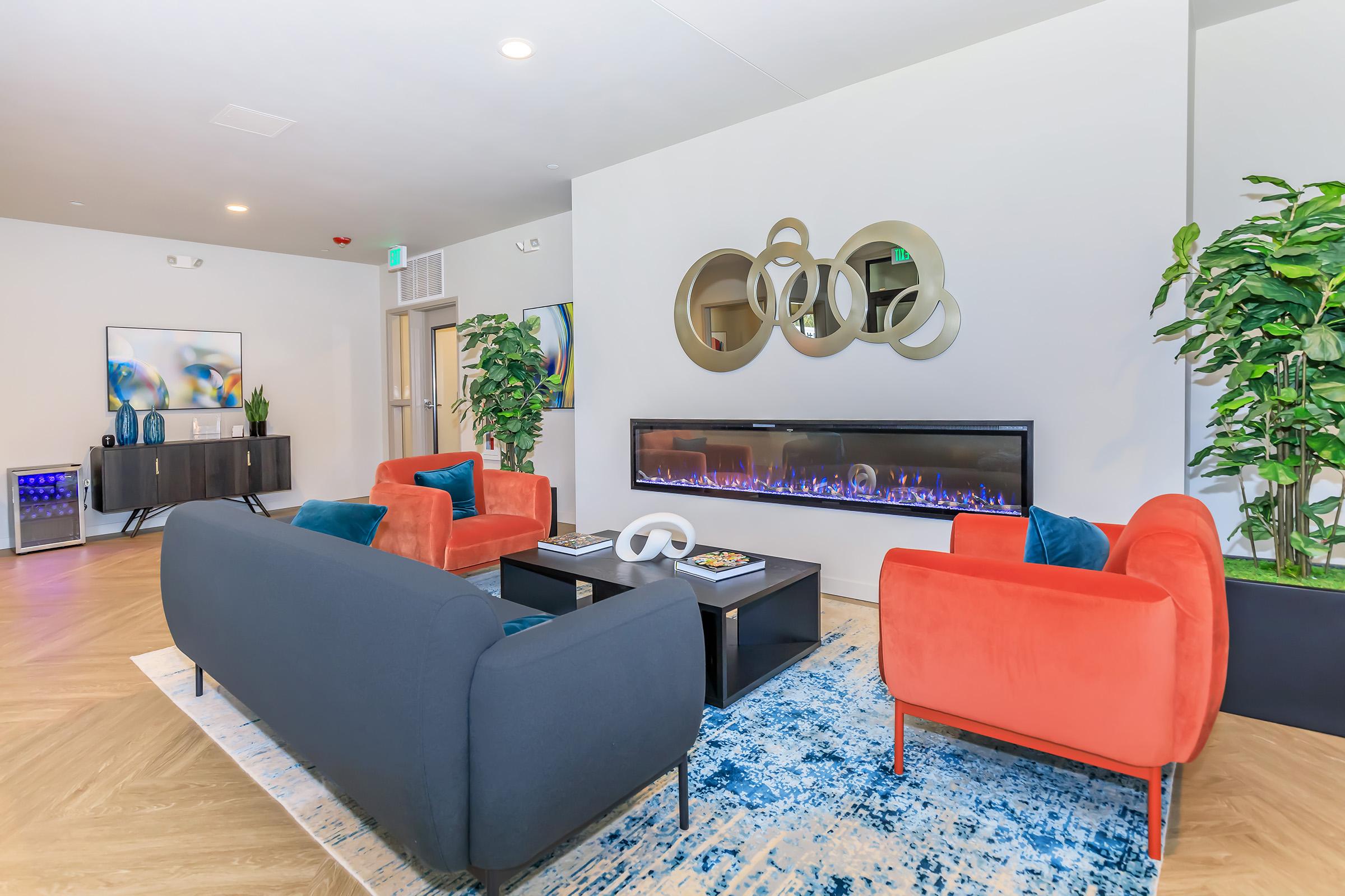 a living room filled with furniture and a flat screen tv