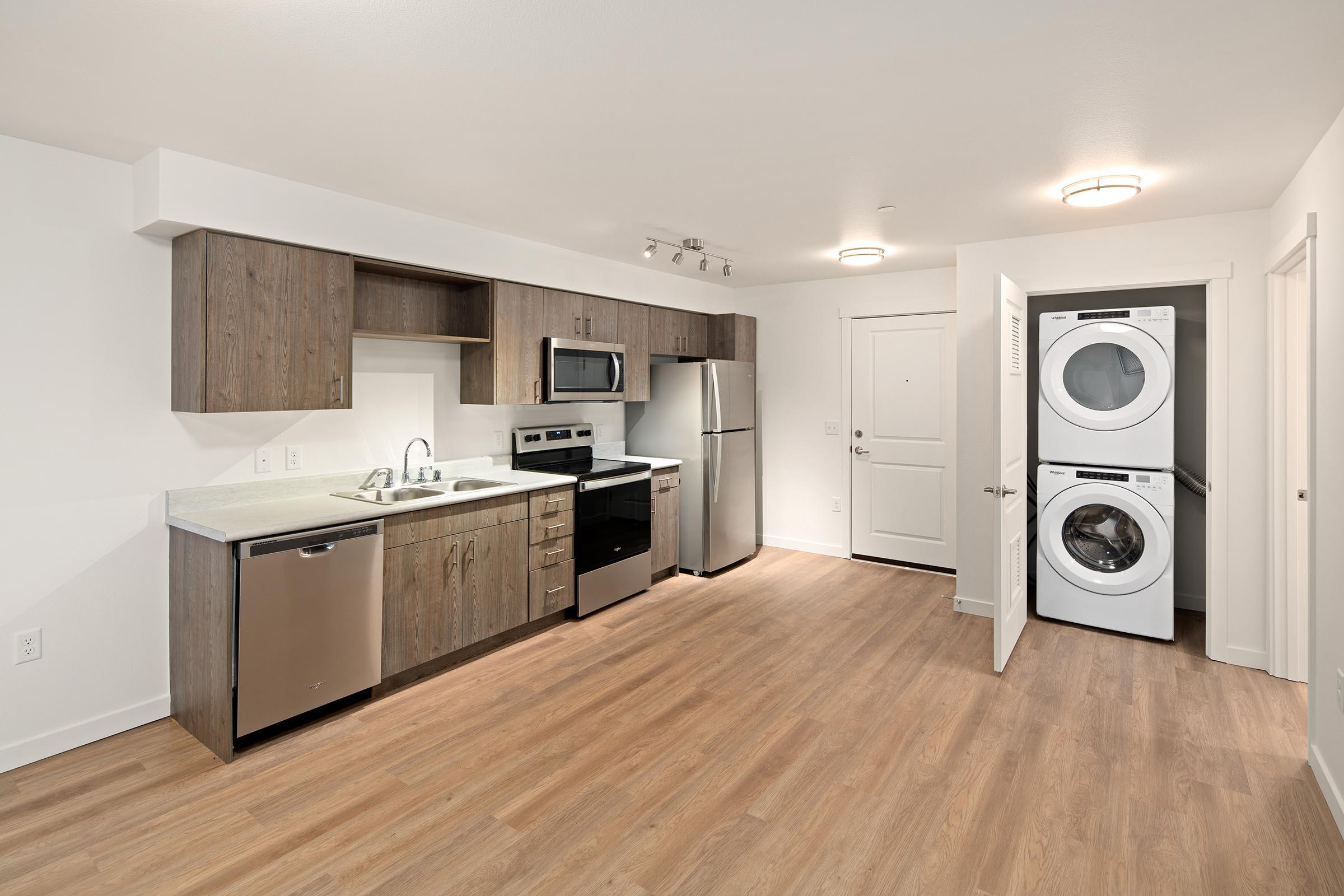 a kitchen with a wood floor