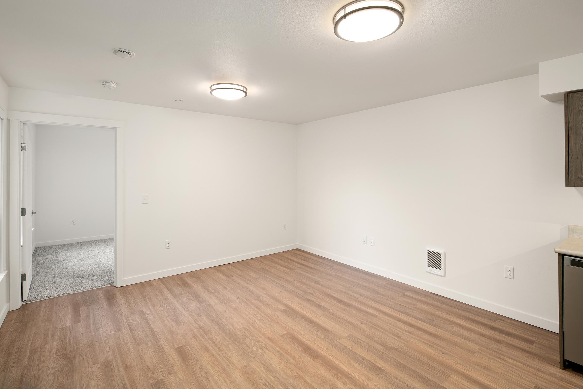 a kitchen with a wood floor