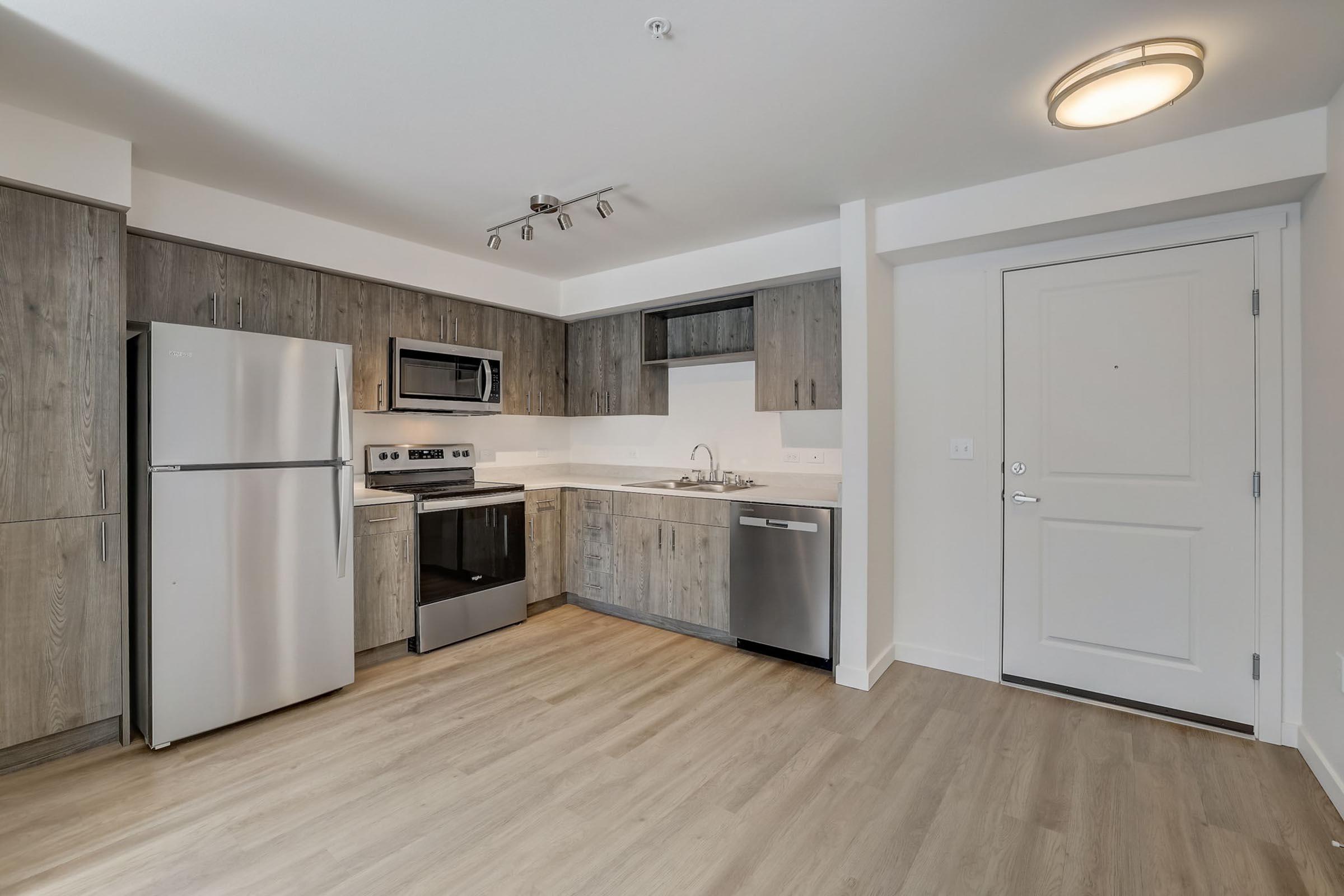 a stainless steel refrigerator in a kitchen