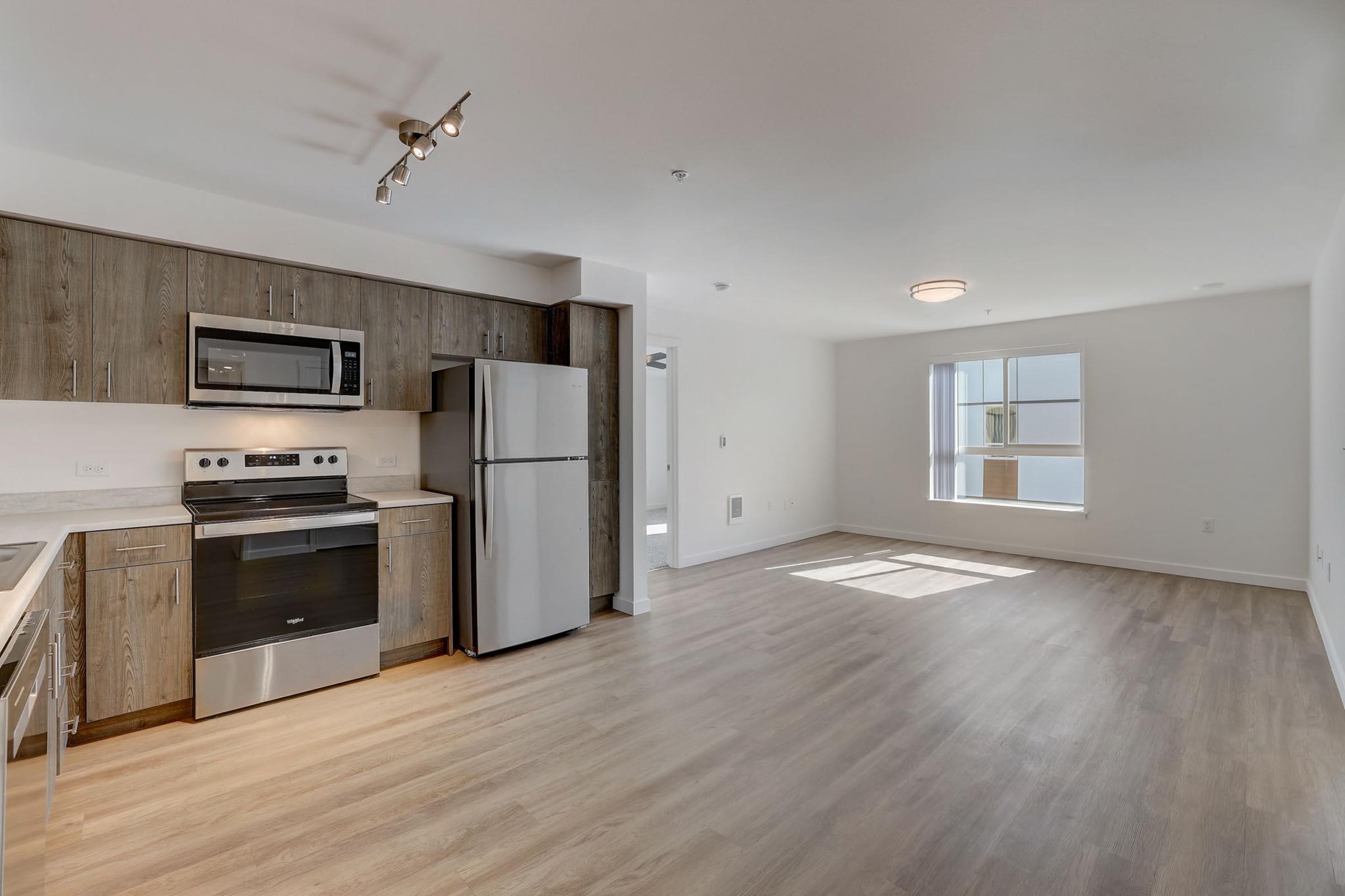 a kitchen with a wood floor