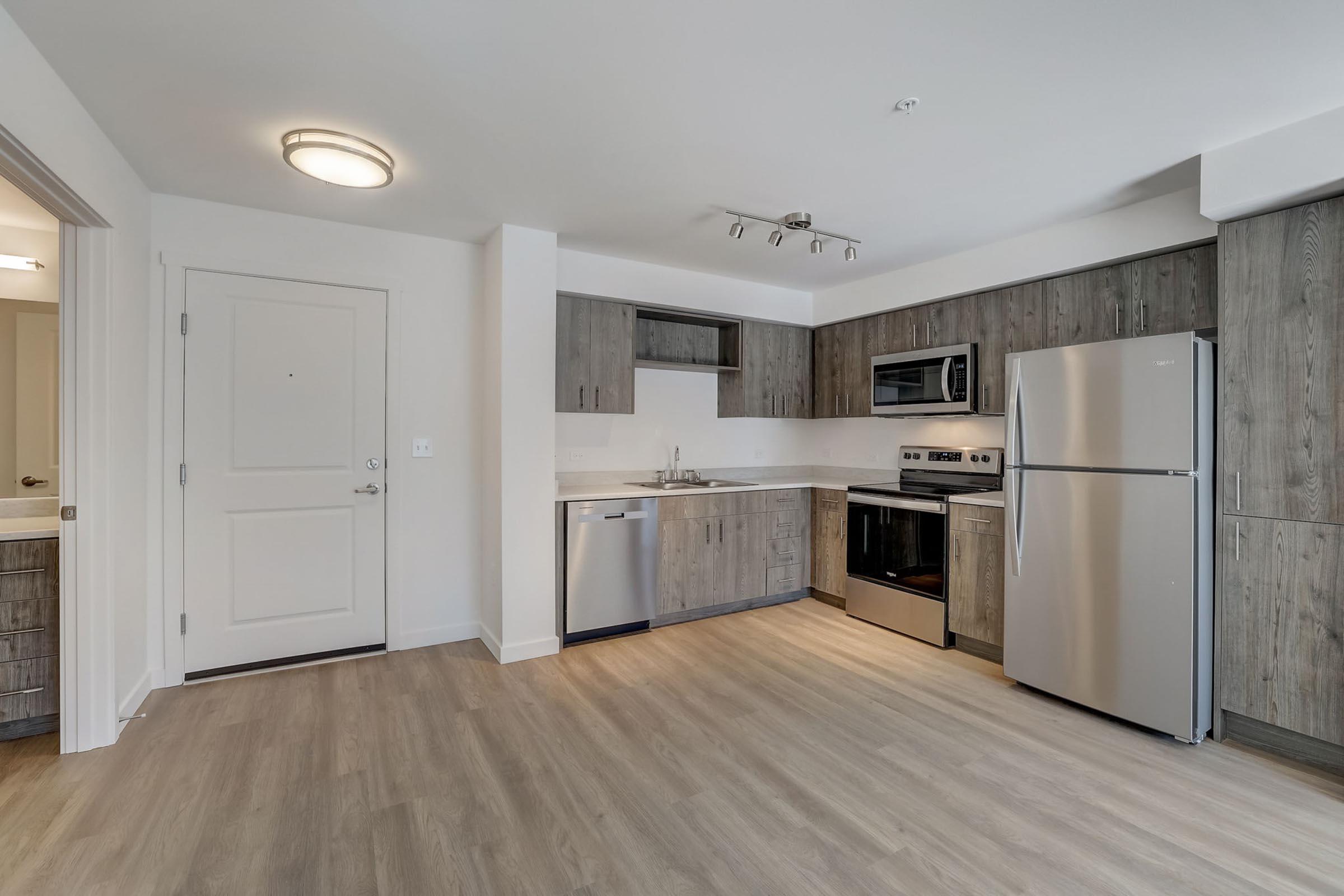 a kitchen with a wood floor