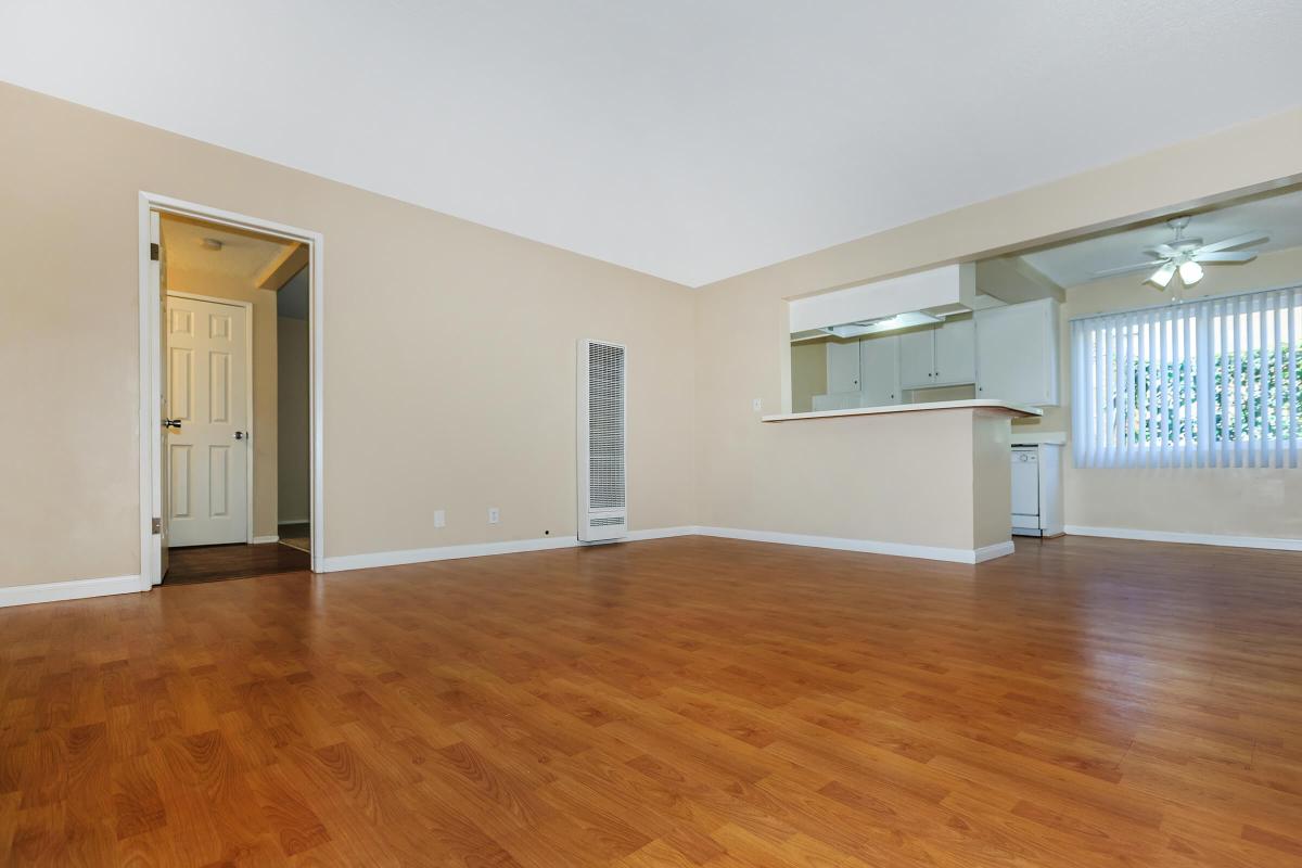 a large empty room with a hard wood floor