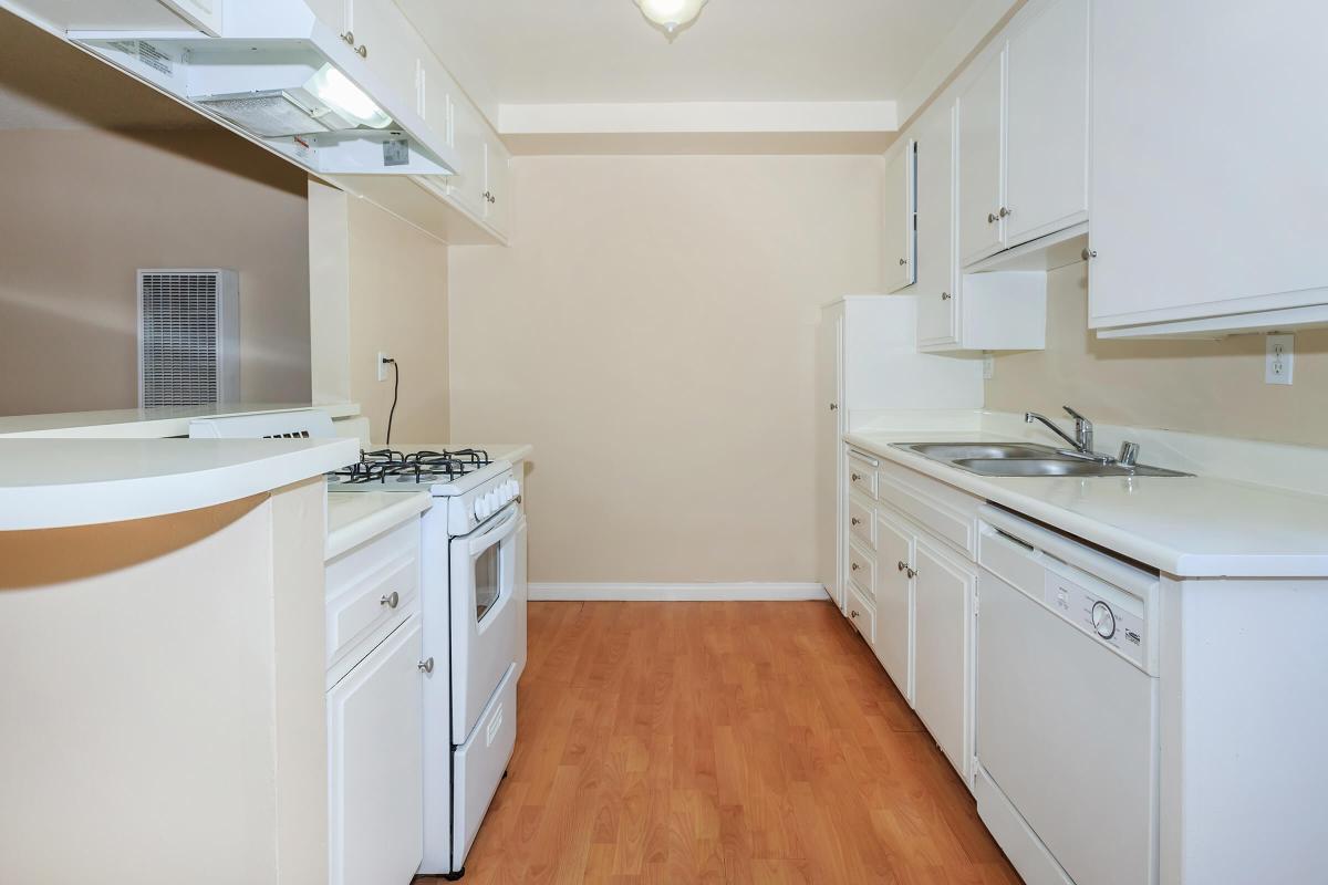 a kitchen with a wood floor