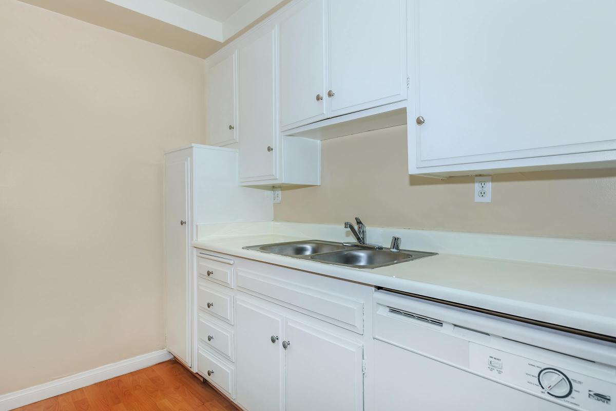 a kitchen with a sink and a microwave