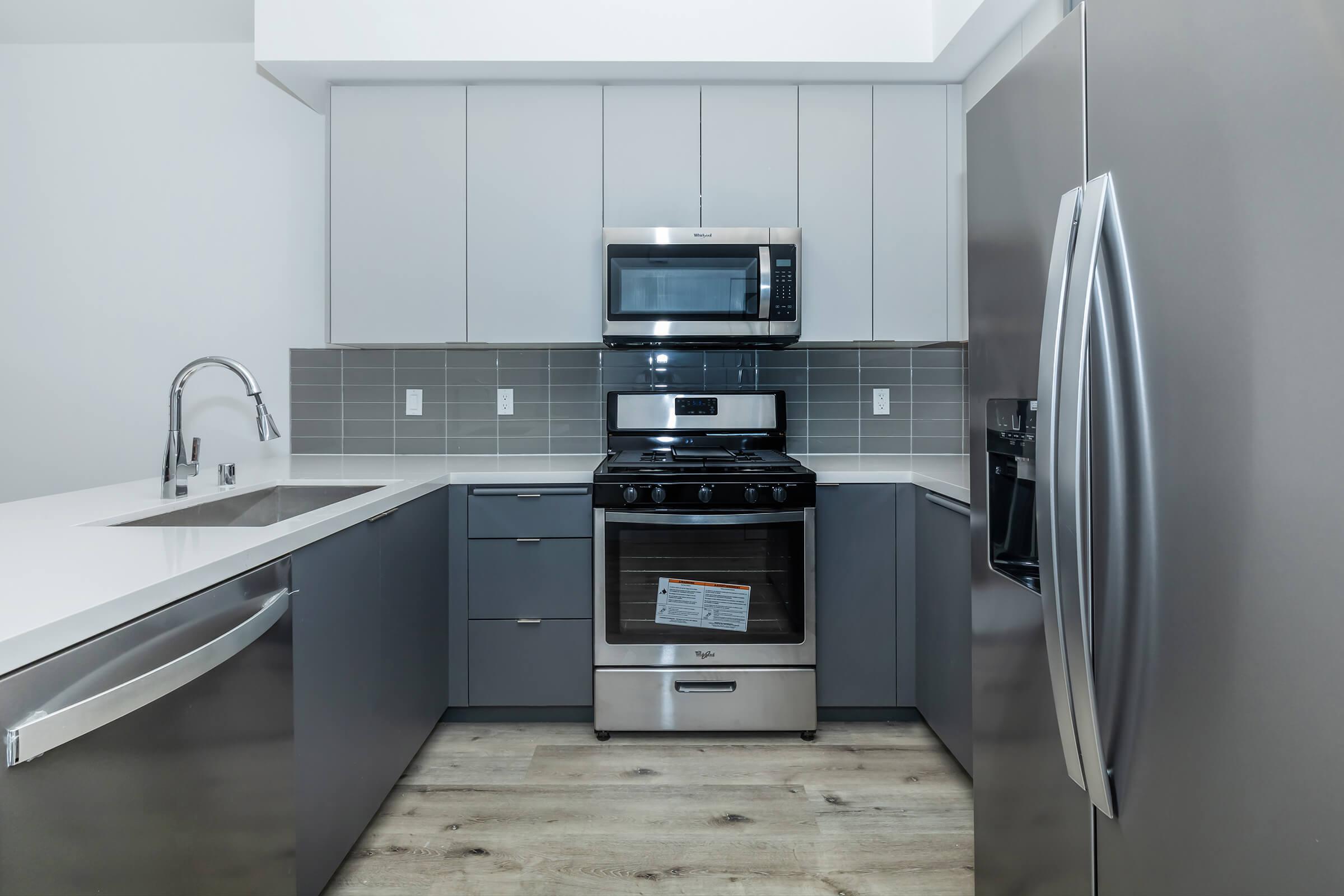 a kitchen with a stove top oven sitting inside of a refrigerator