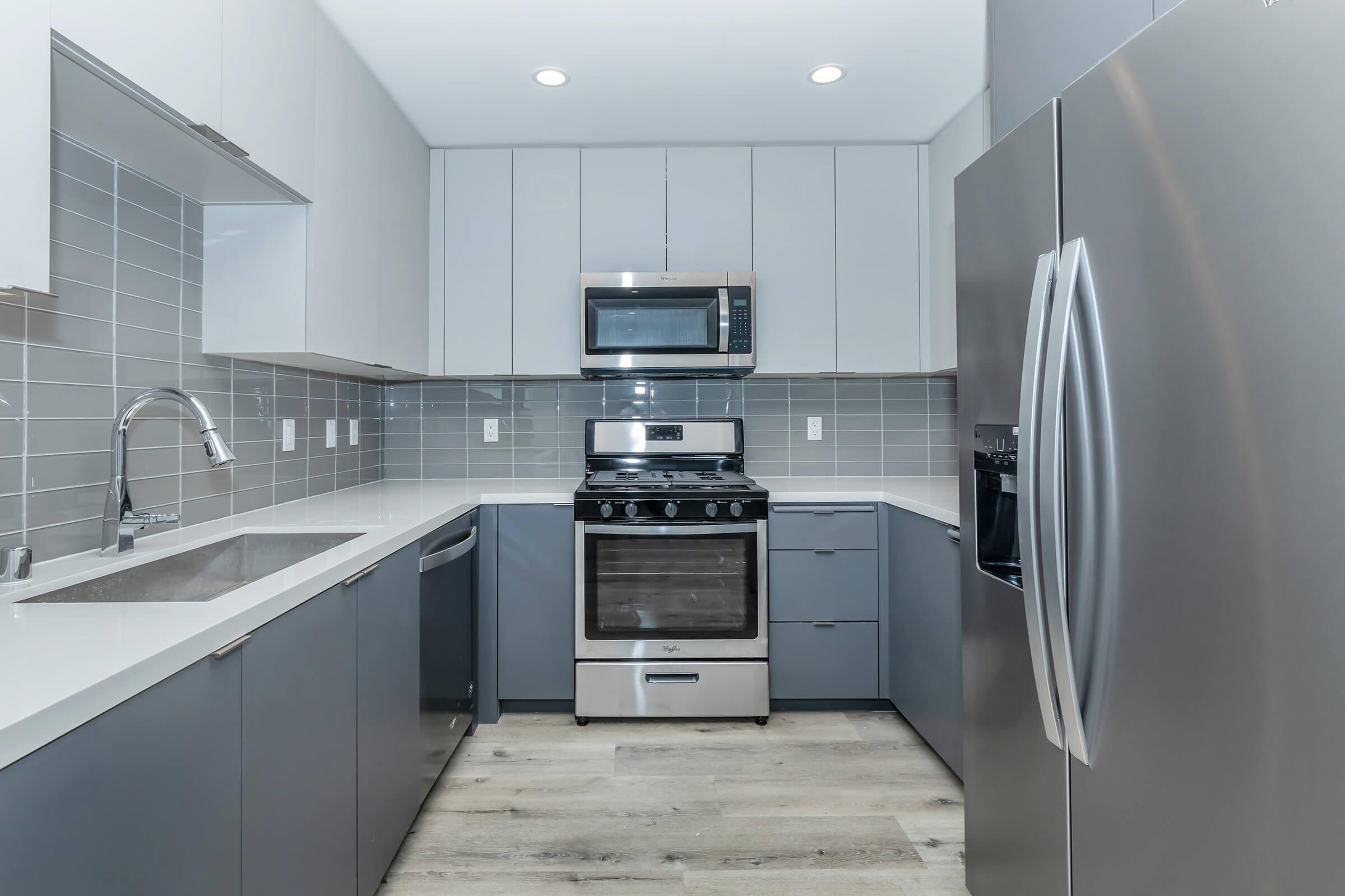 a modern kitchen with stainless steel appliances