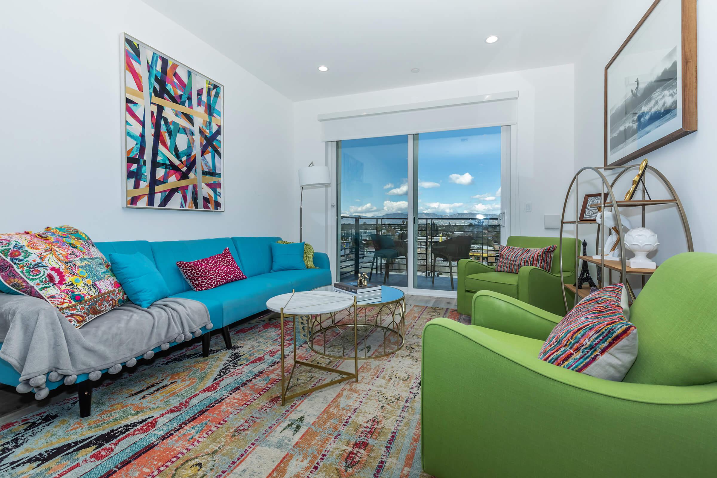 a bedroom with a view of a living room