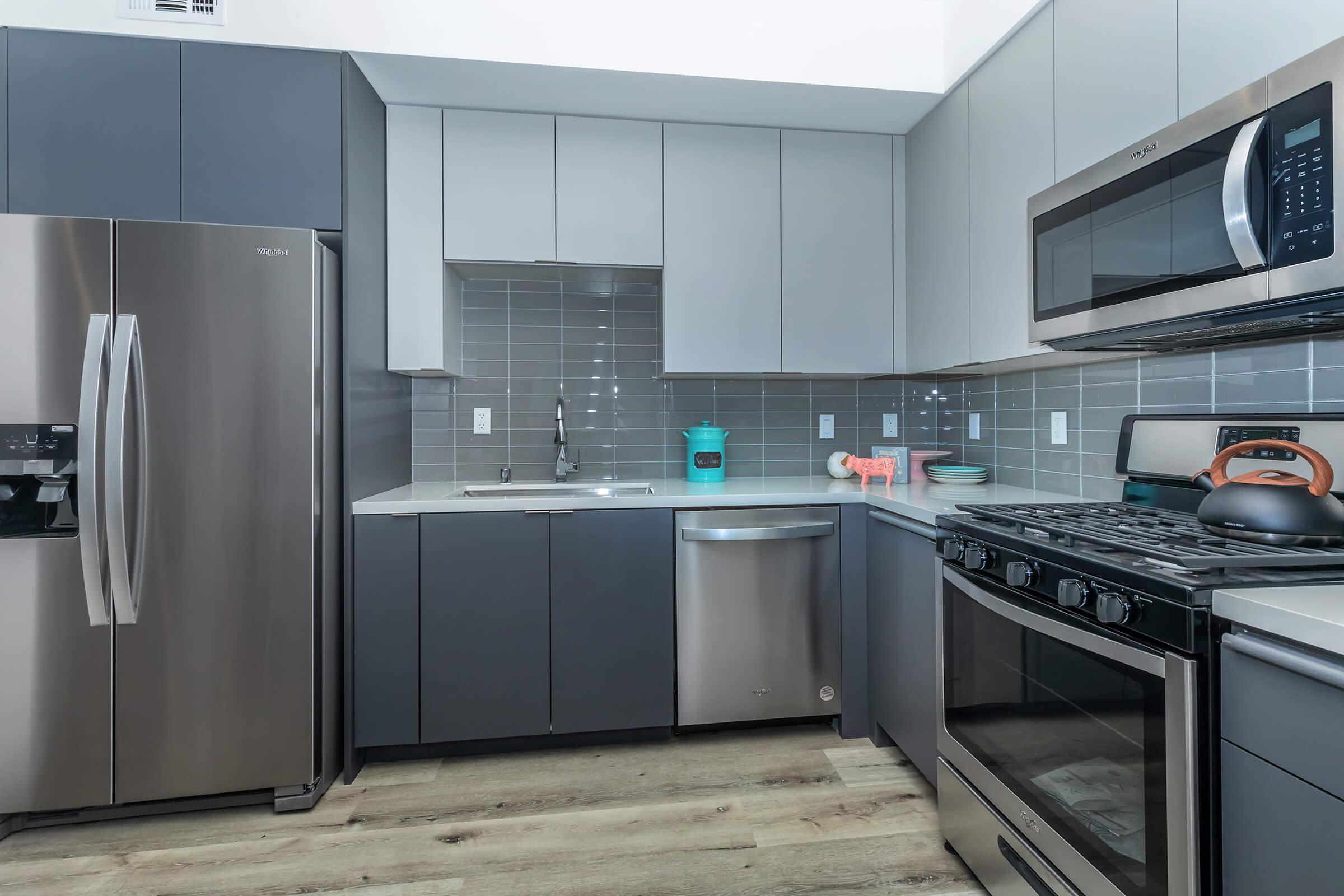 a large kitchen with stainless steel appliances