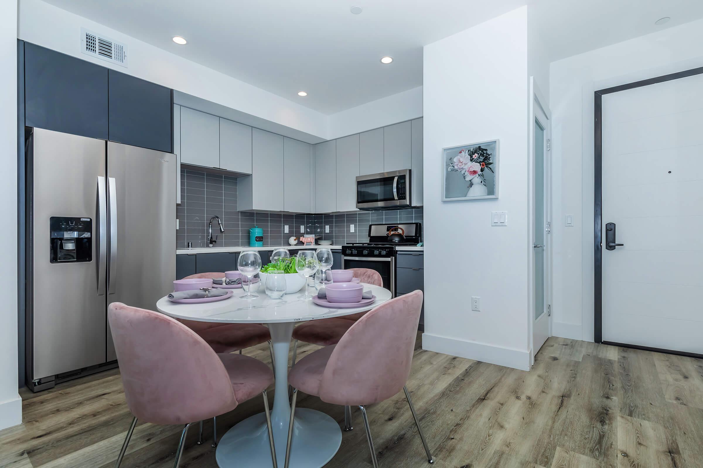 a kitchen with a table in a room