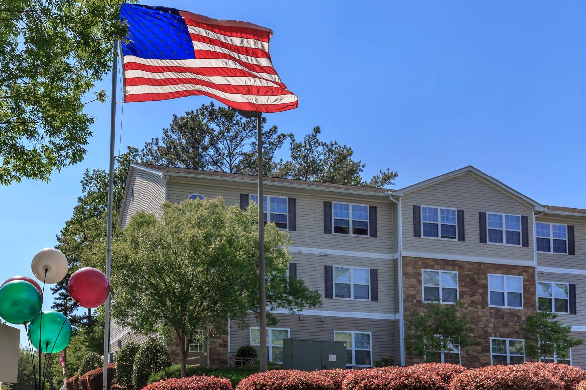 a flag flying in front of a building