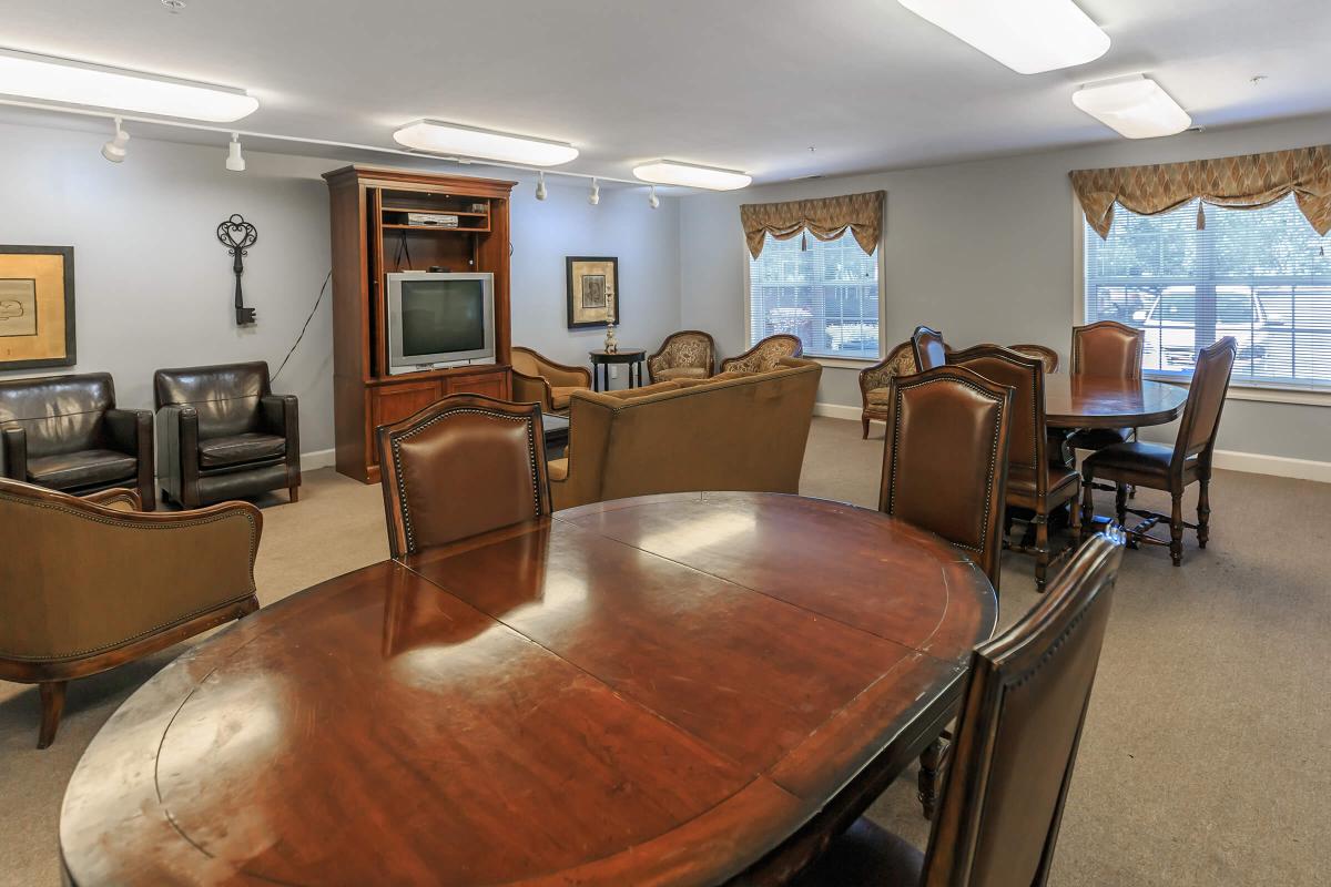 a living room filled with furniture and a large window