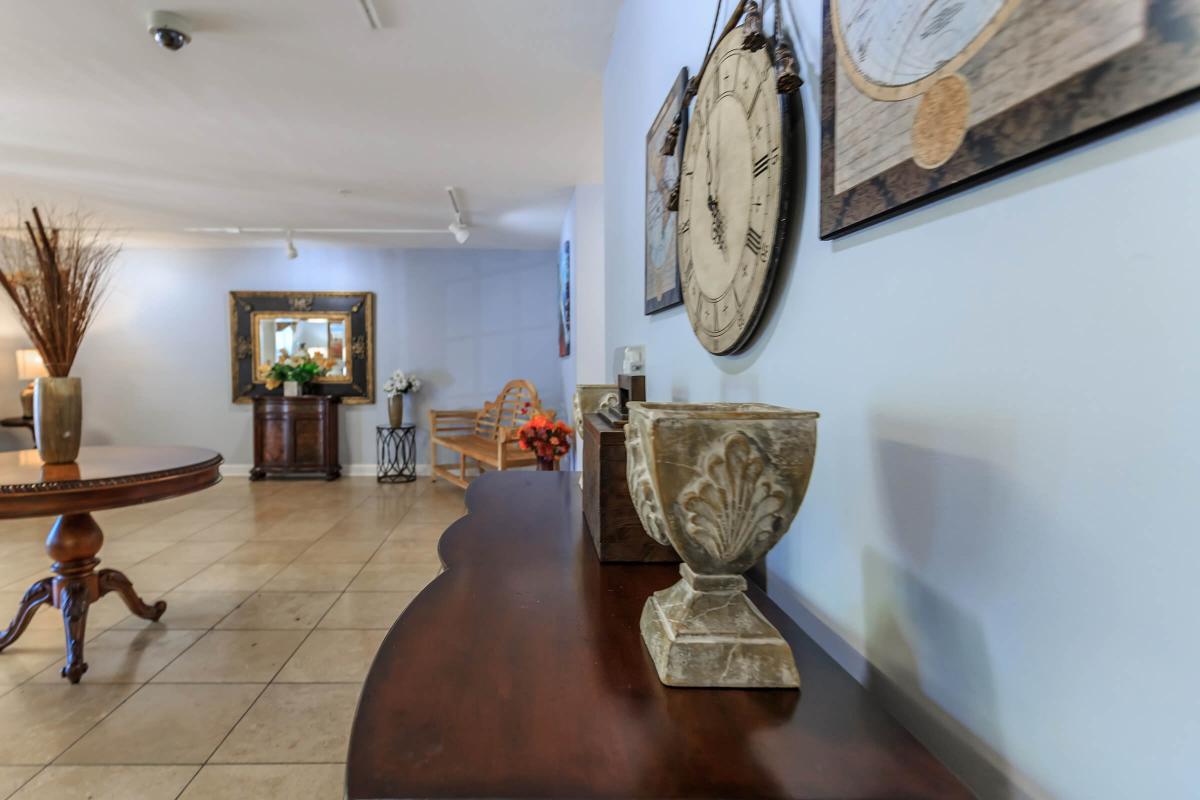 a room that has a clock on a table