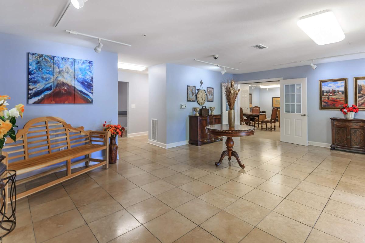 a living room filled with furniture and a wood floor