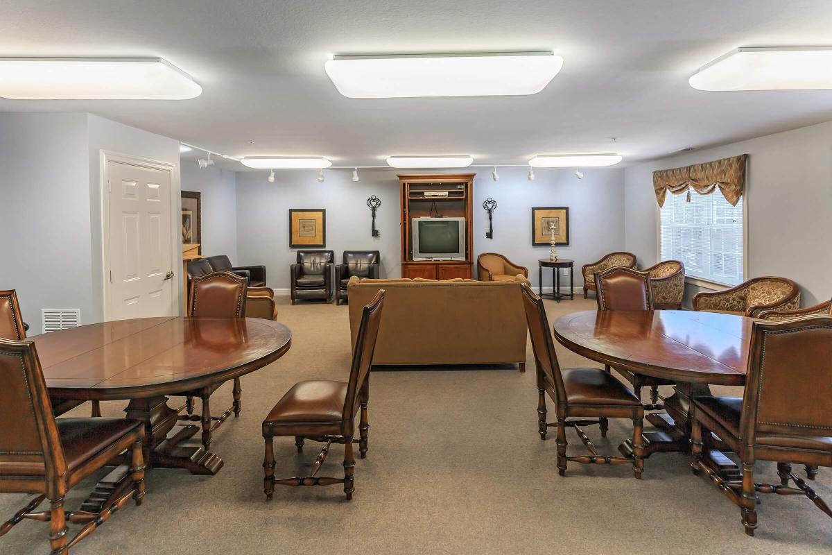 a living room filled with furniture and a table