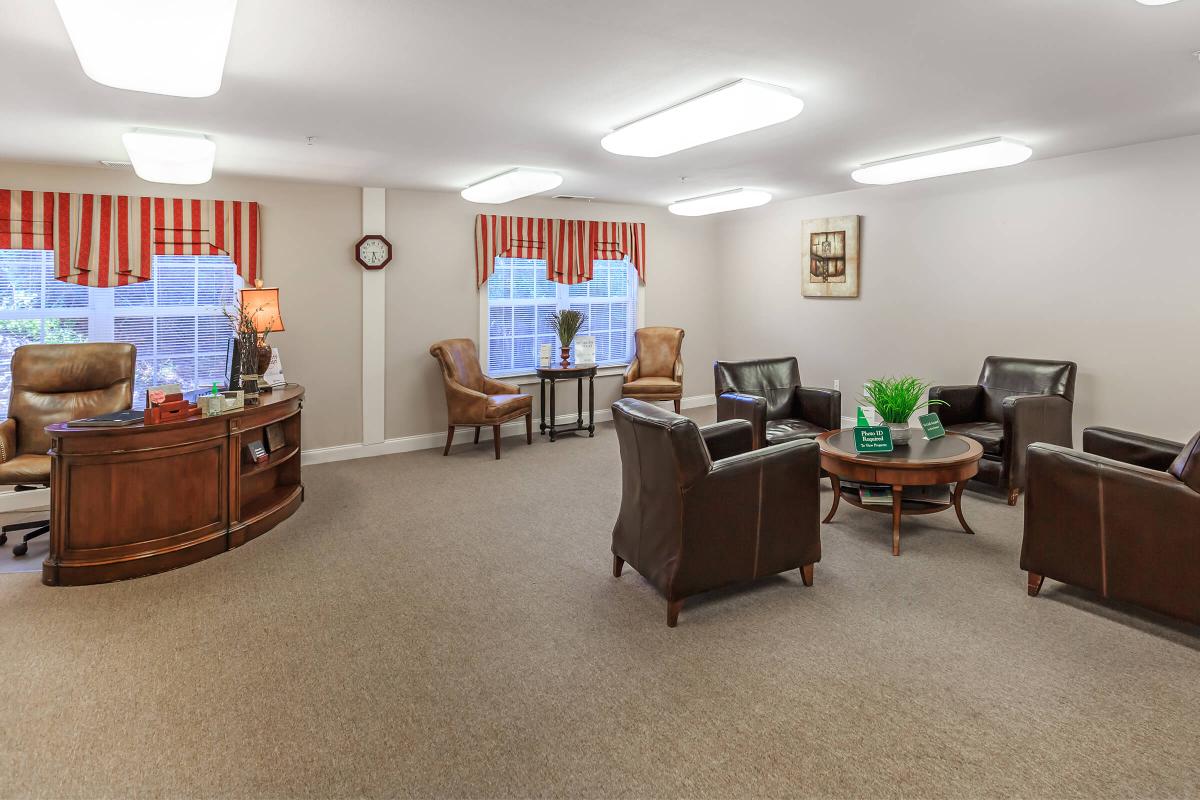 a living room filled with furniture and a tv