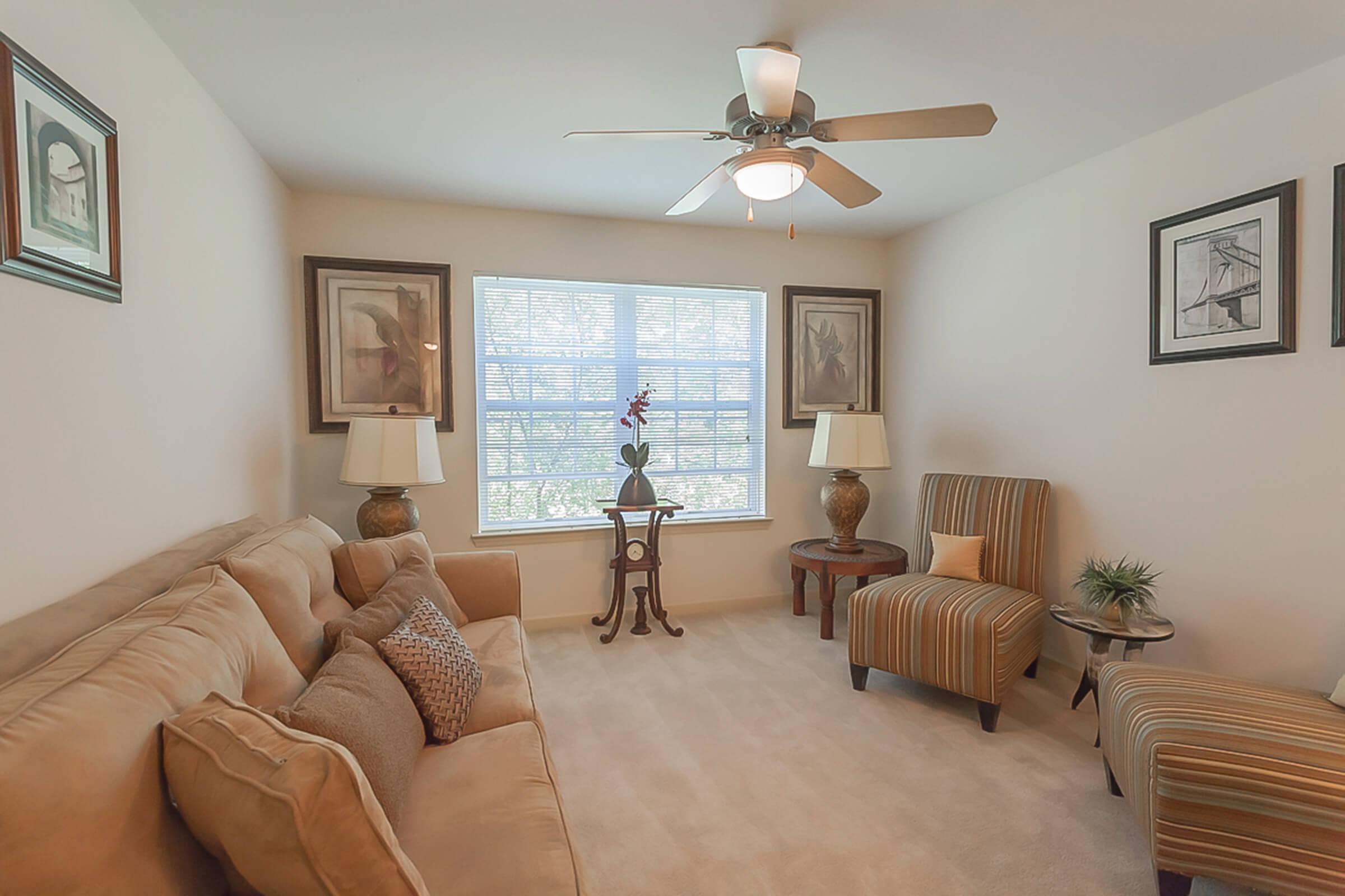 a living room filled with furniture and a fireplace