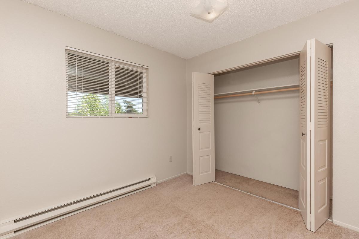 a white refrigerator freezer sitting inside of a building