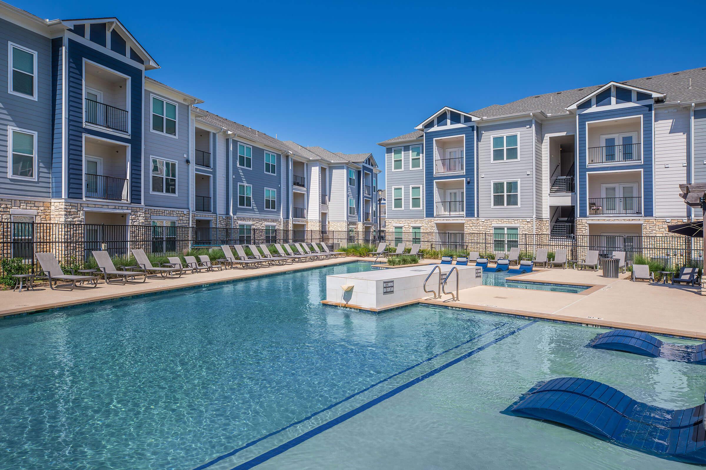 a large pool of water in front of a building