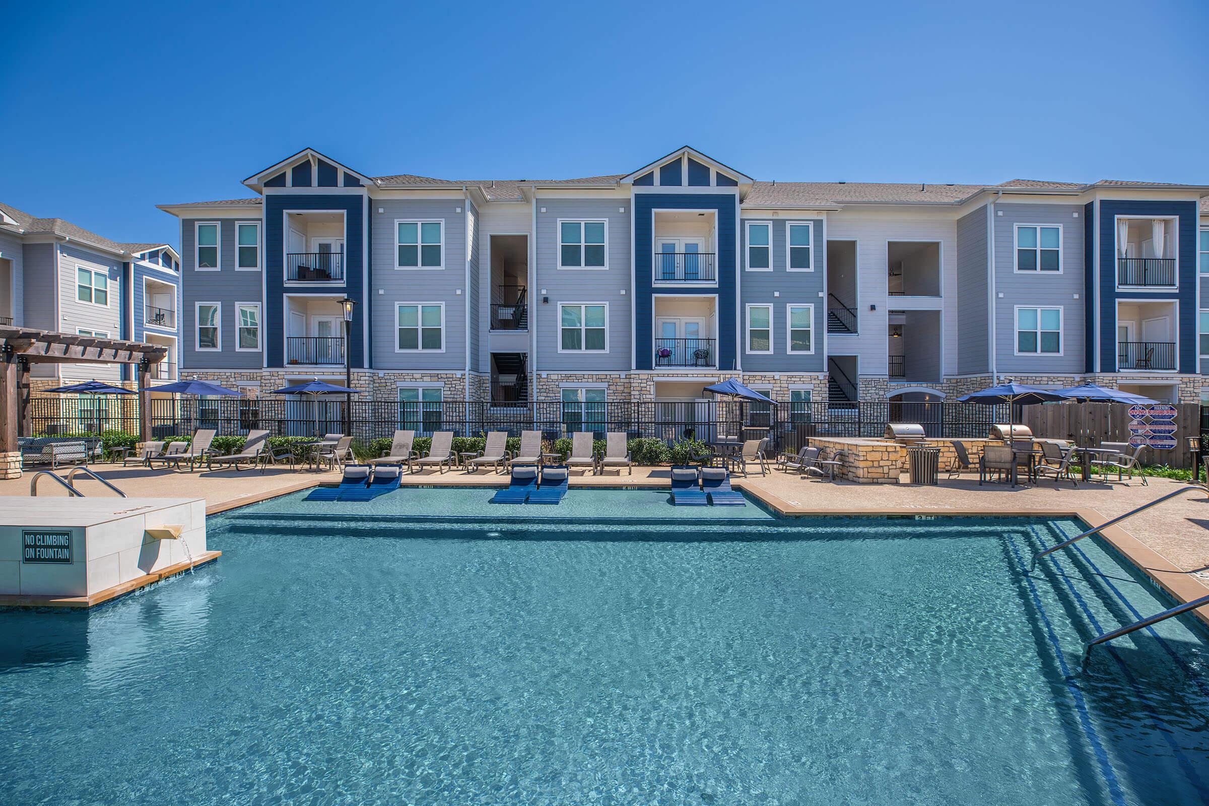 a large pool of water in front of a building