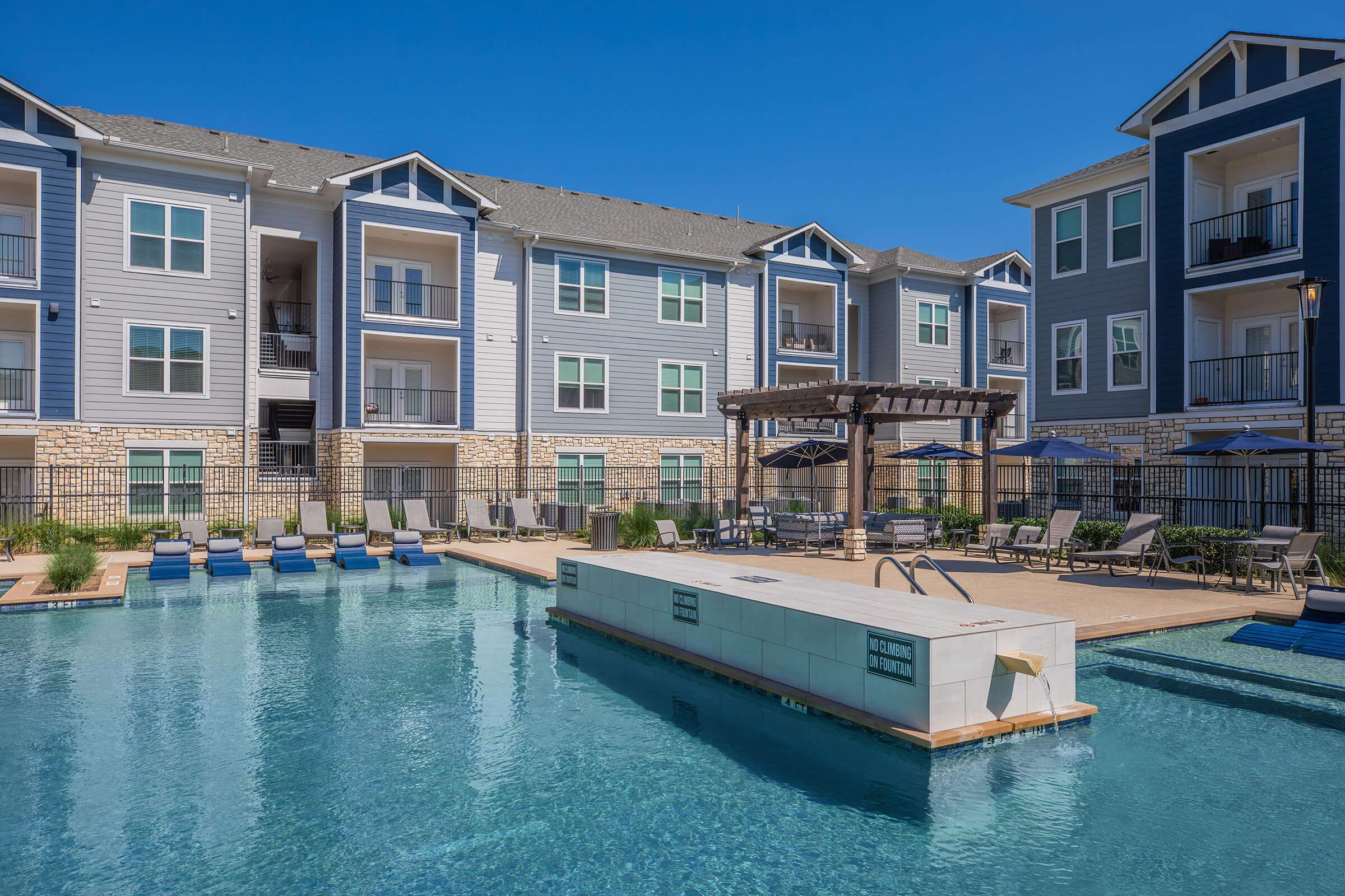 a large pool of water in front of a building