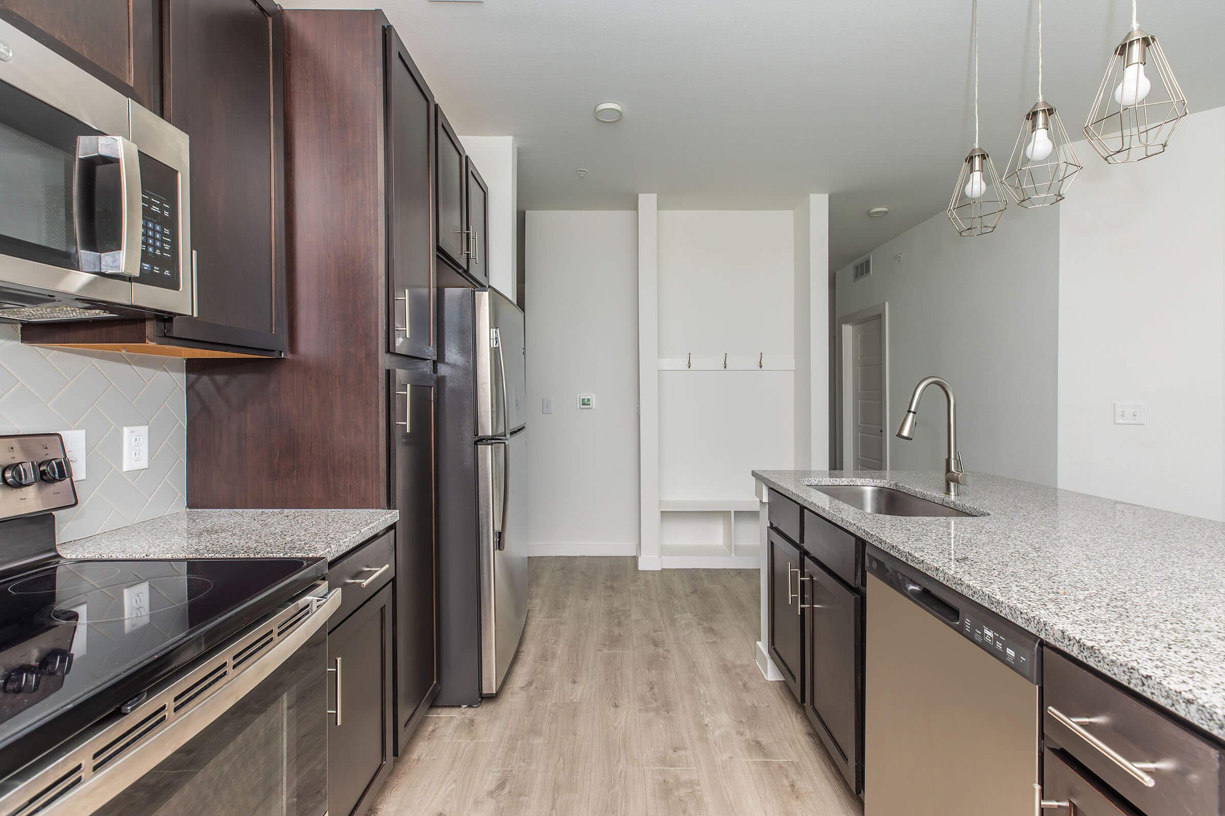 a modern kitchen with stainless steel appliances